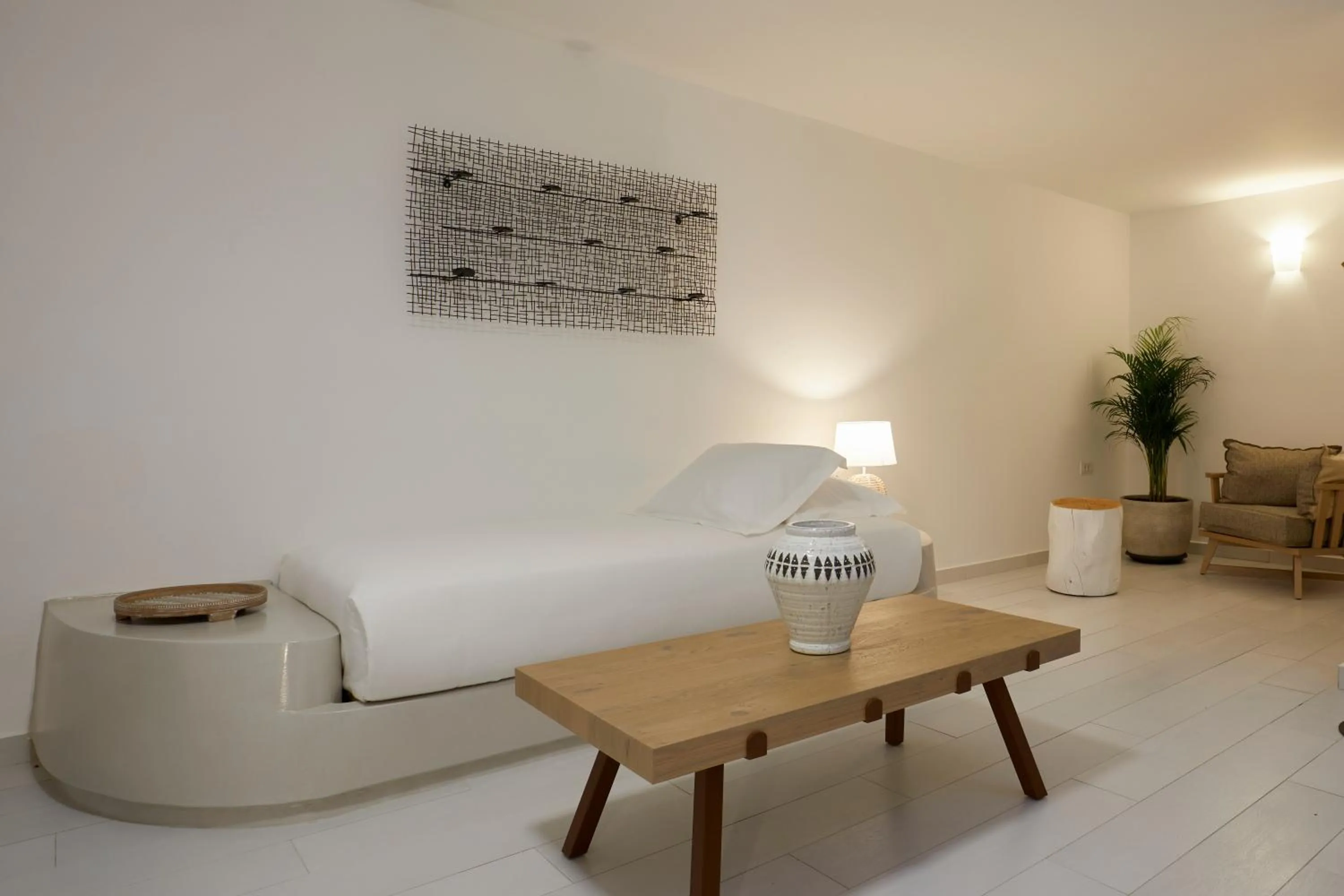 Bed in Sea Breeze Santorini Beach Resort, Curio By Hilton