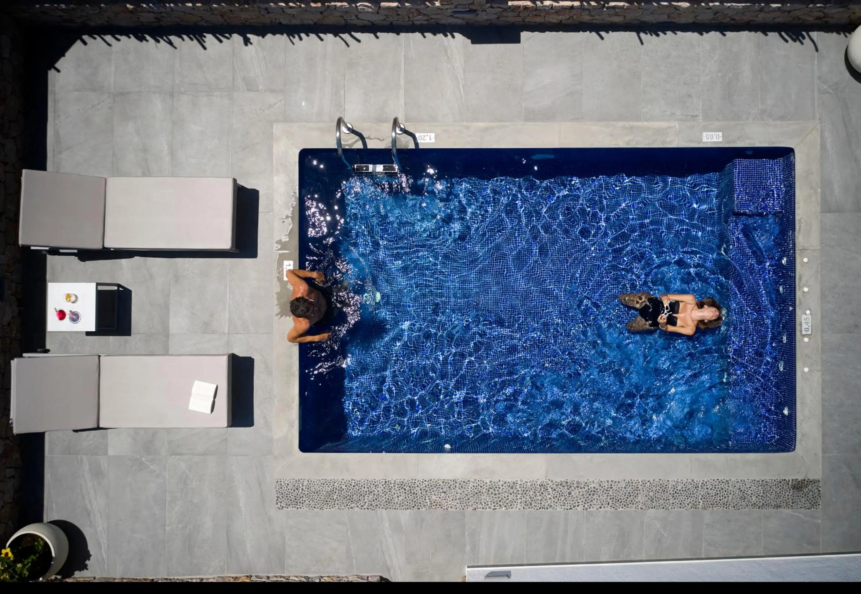 Guests in Sea Breeze Santorini Beach Resort, Curio By Hilton
