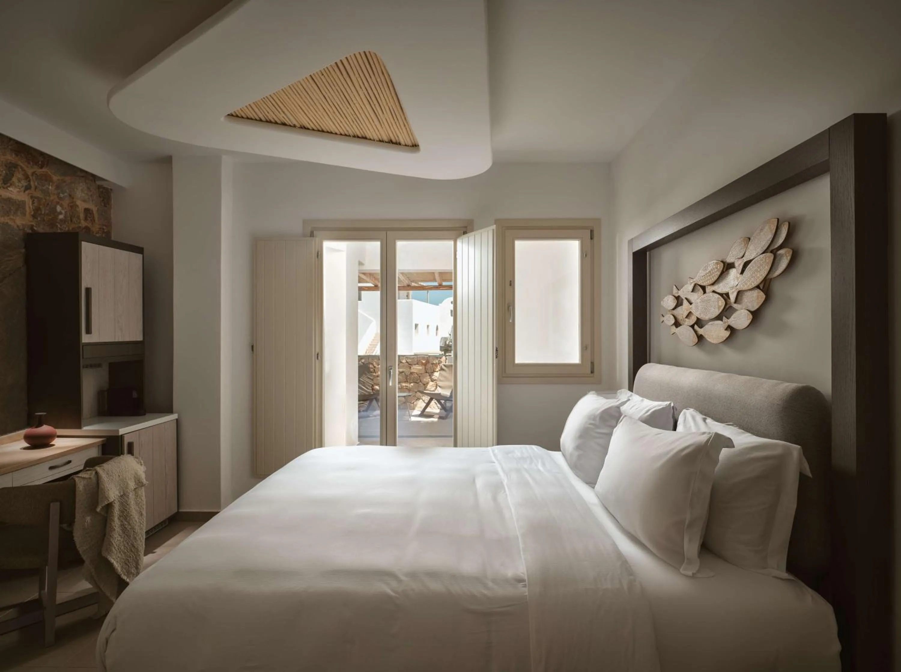 Bed in Sea Breeze Santorini Beach Resort, Curio By Hilton