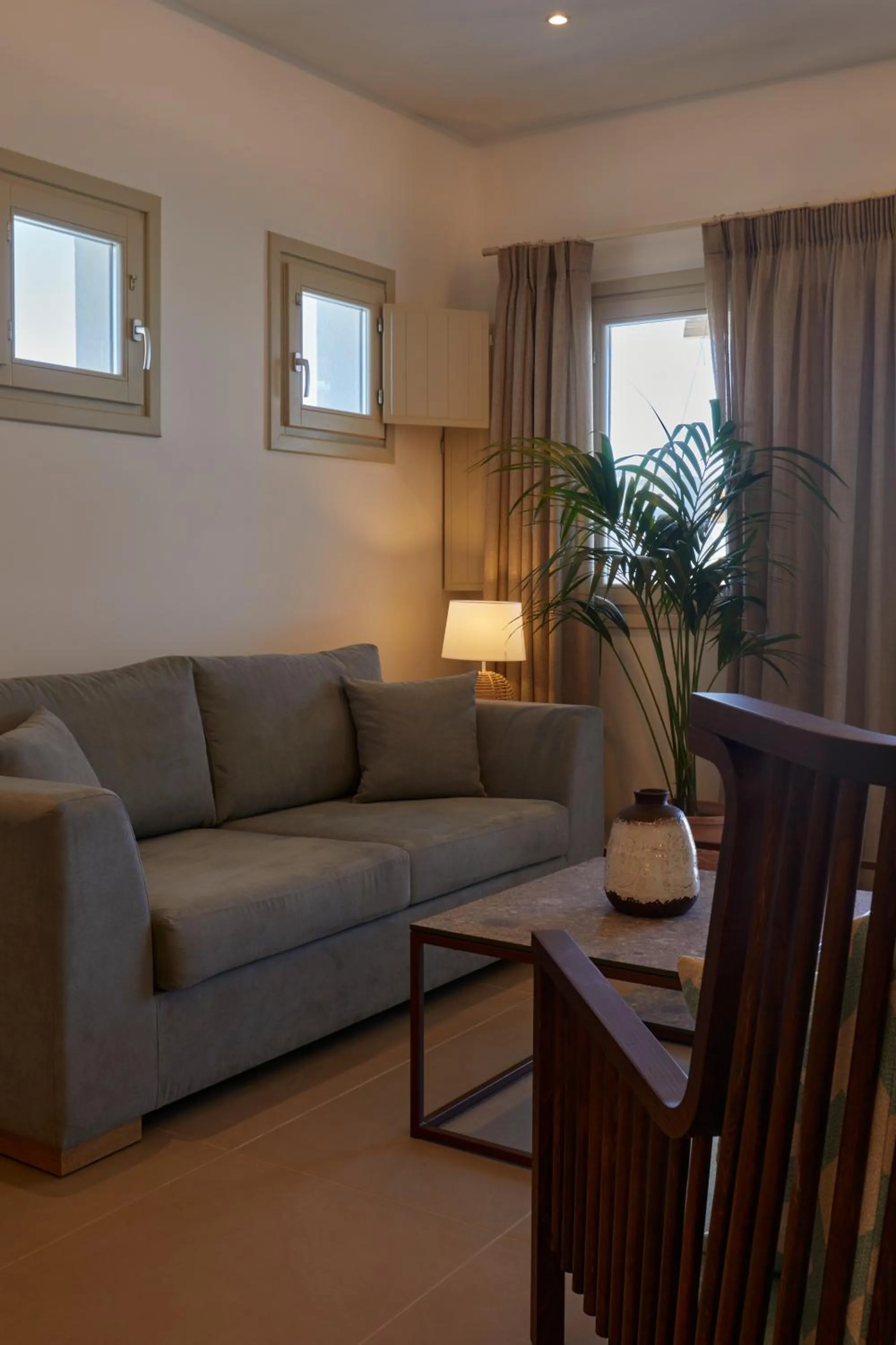 Living room in Sea Breeze Santorini Beach Resort, Curio By Hilton