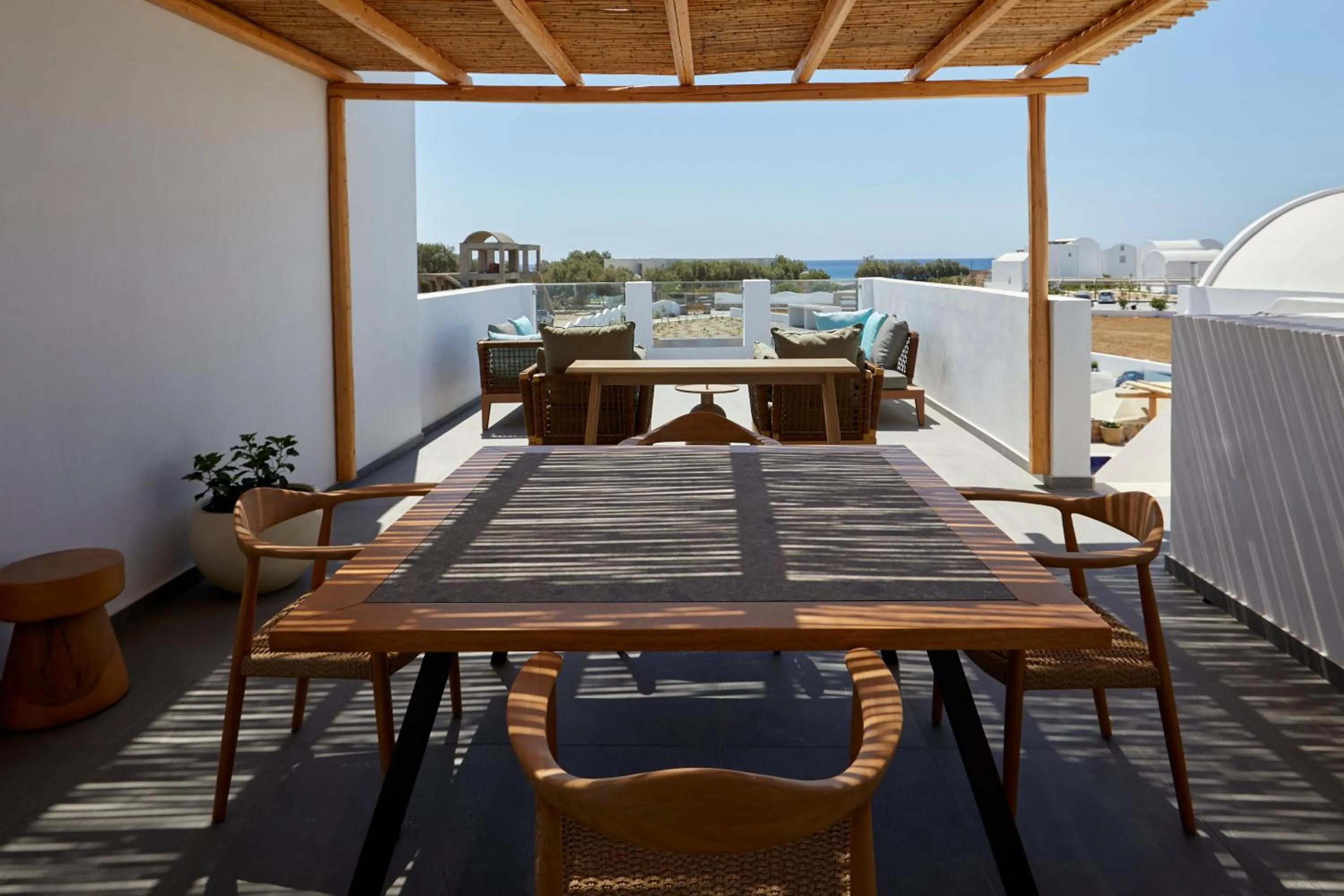 Patio in Sea Breeze Santorini Beach Resort, Curio By Hilton
