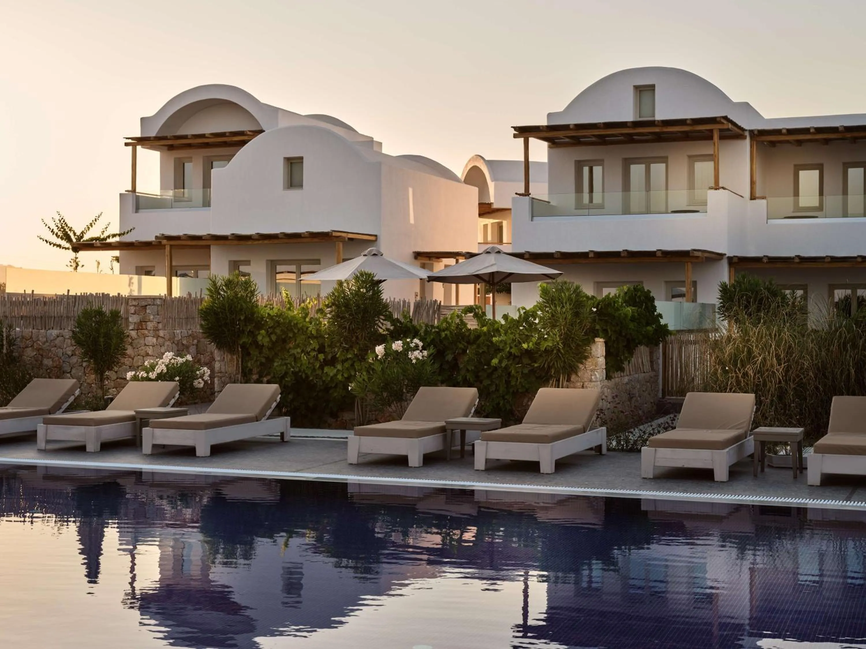 Pool view in Sea Breeze Santorini Beach Resort, Curio By Hilton