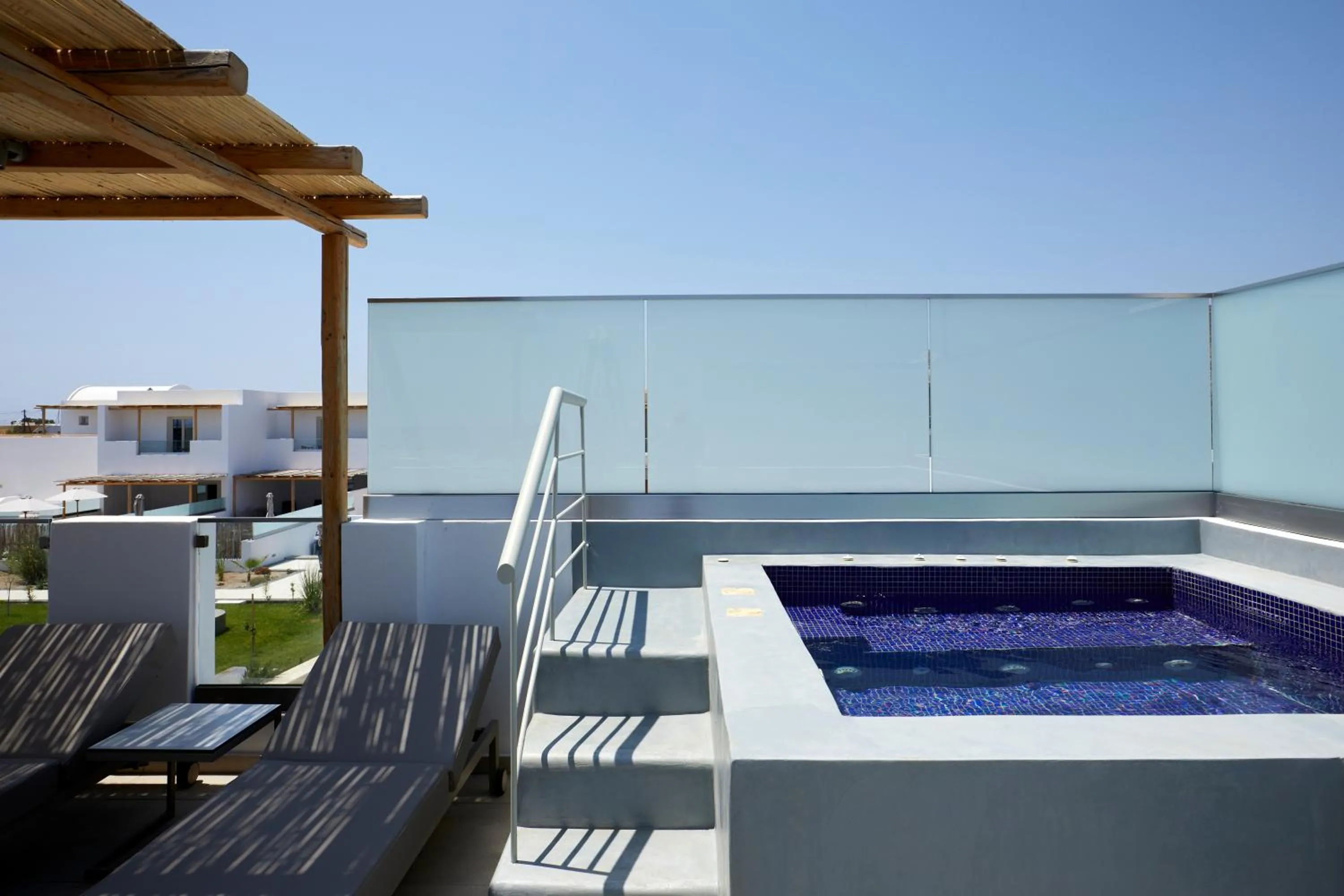 Hot Tub in Sea Breeze Santorini Beach Resort, Curio By Hilton