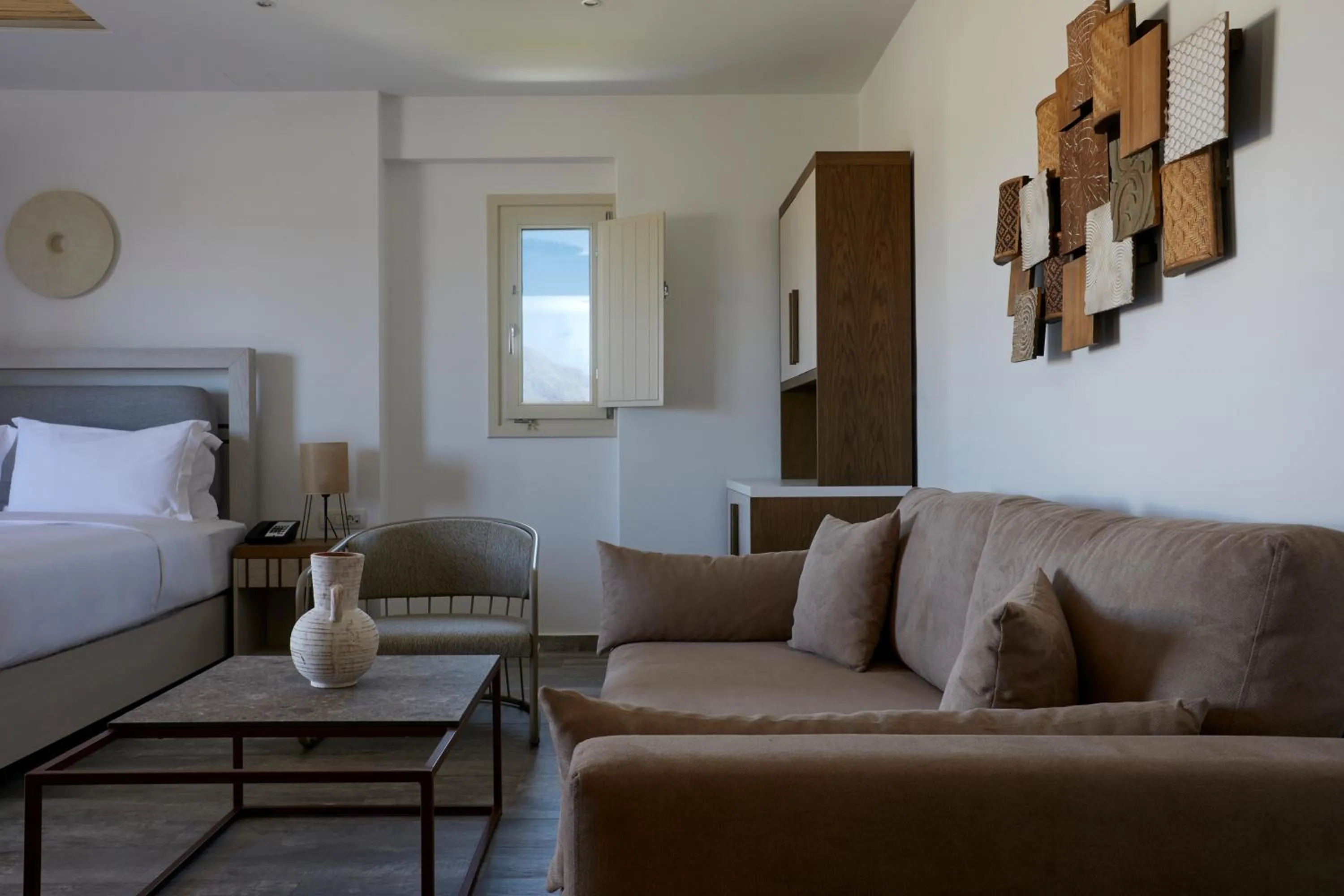 Bed in Sea Breeze Santorini Beach Resort, Curio By Hilton