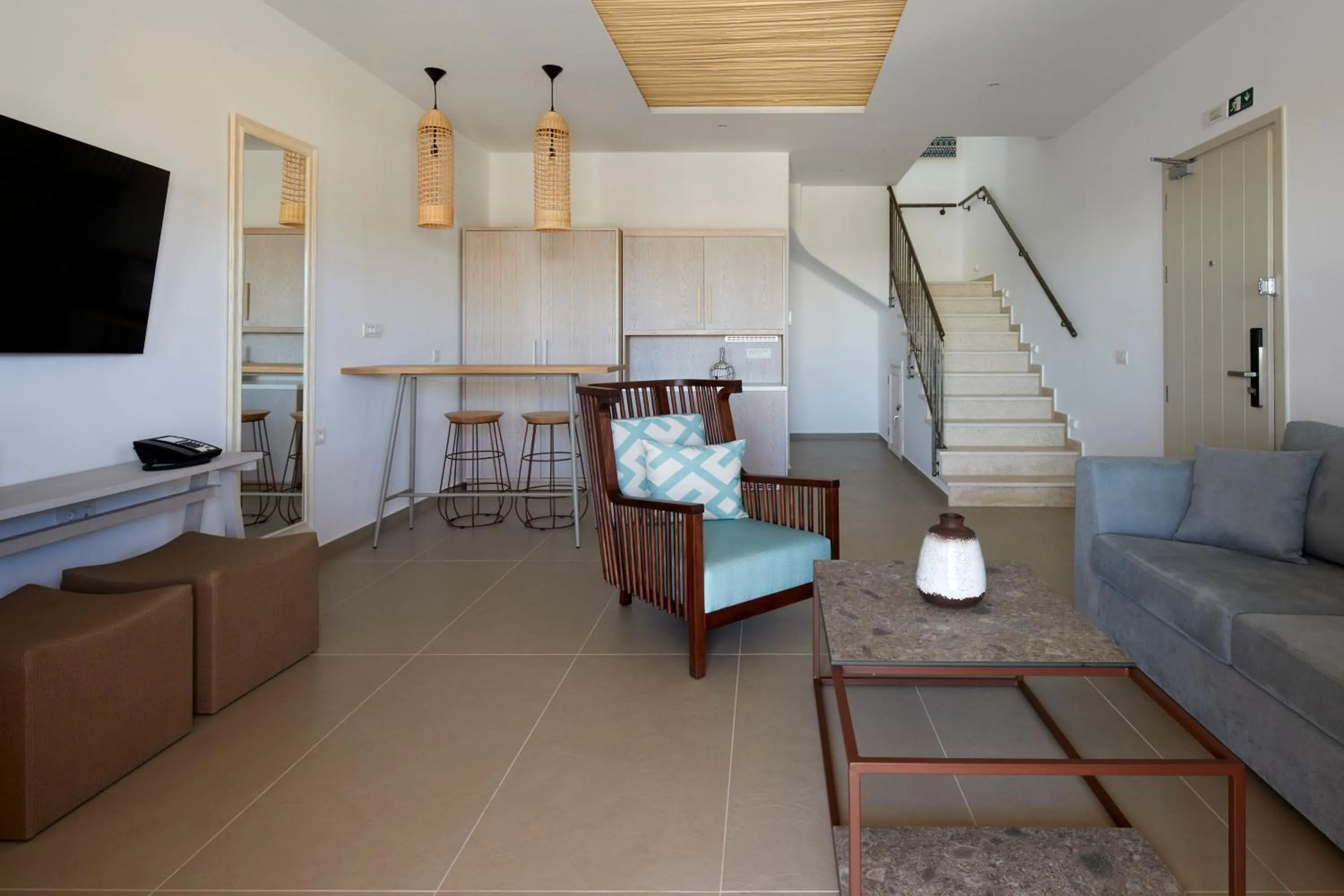 Living room in Sea Breeze Santorini Beach Resort, Curio By Hilton