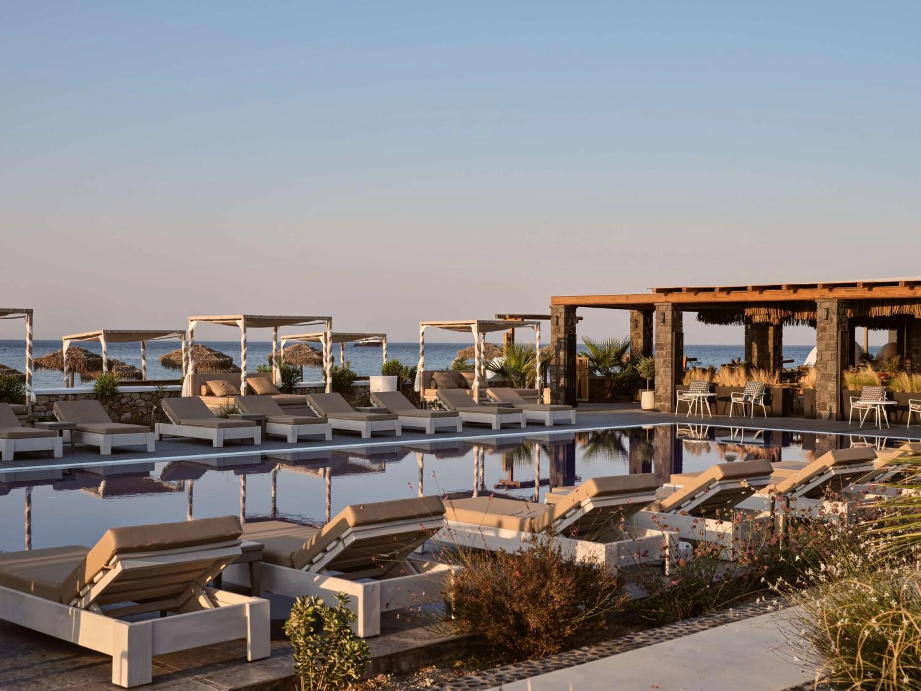 Pool view in Sea Breeze Santorini Beach Resort, Curio By Hilton