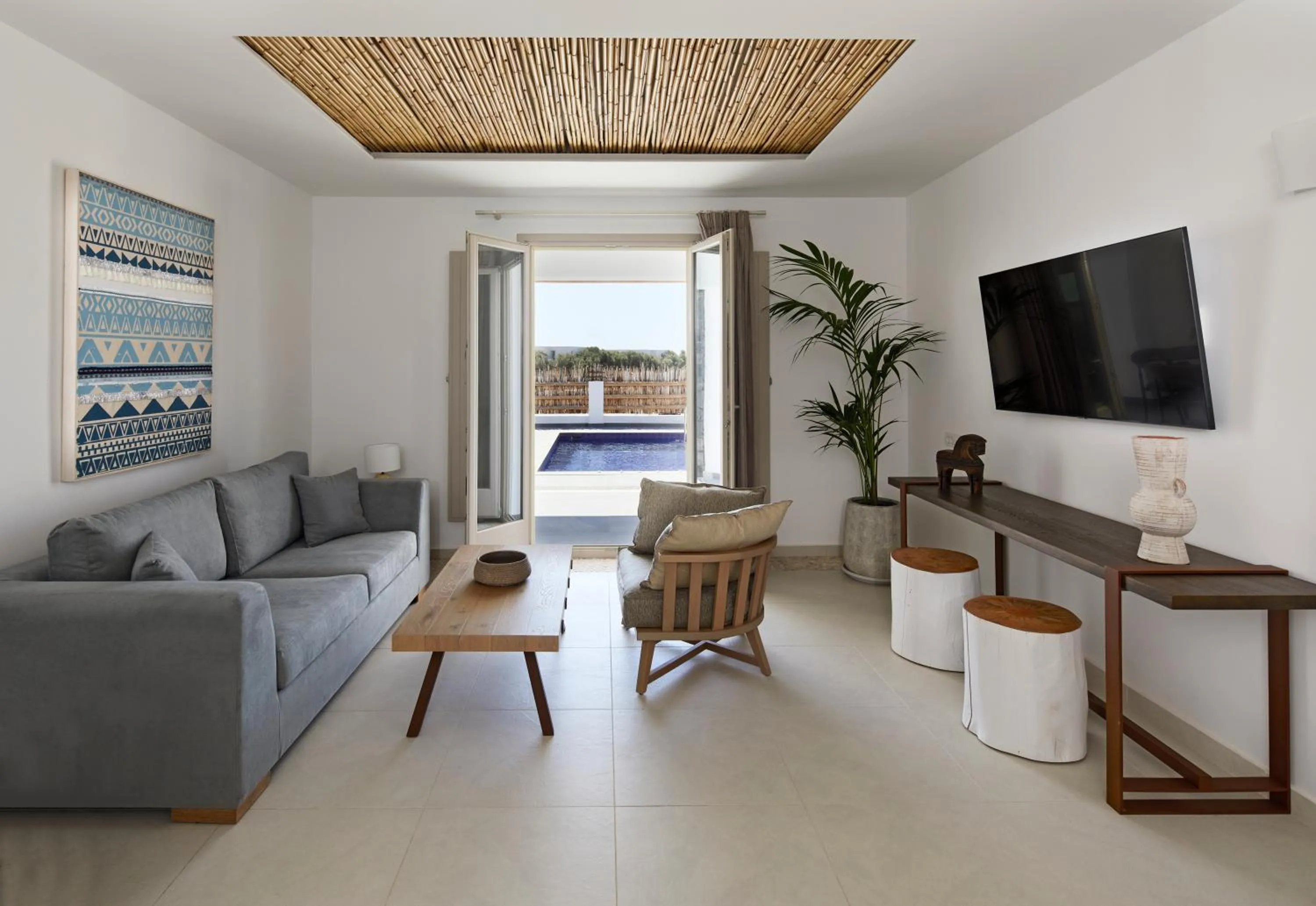 TV and multimedia in Sea Breeze Santorini Beach Resort, Curio By Hilton