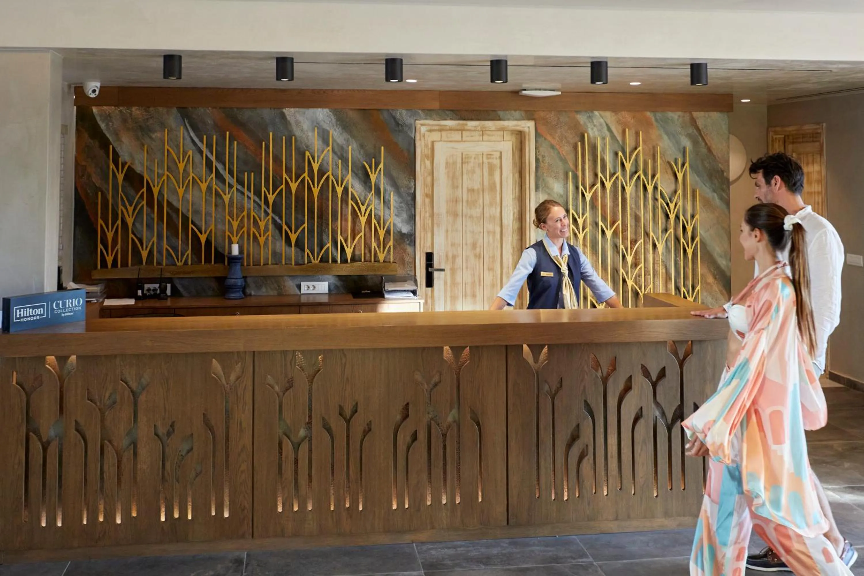 Staff in Sea Breeze Santorini Beach Resort, Curio By Hilton