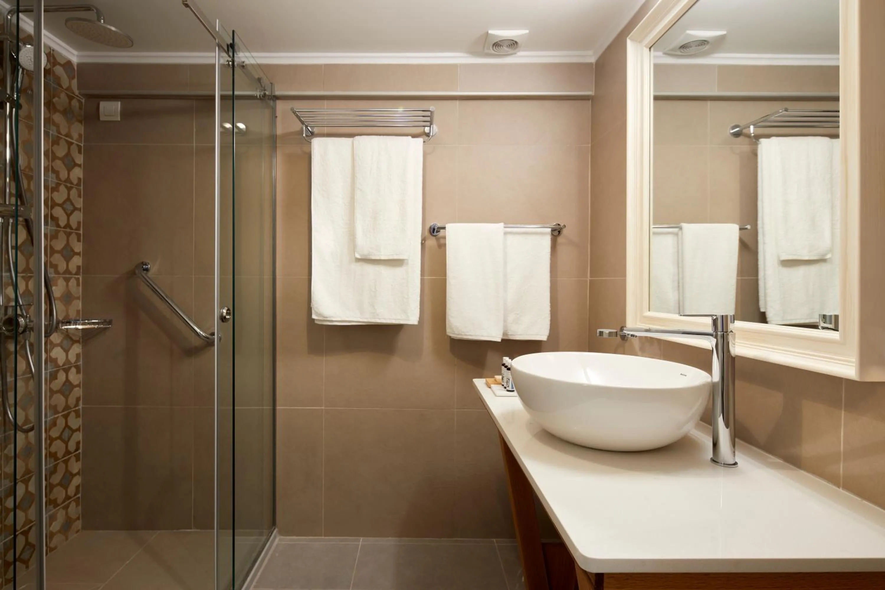 Shower in Sea Breeze Santorini Beach Resort, Curio By Hilton