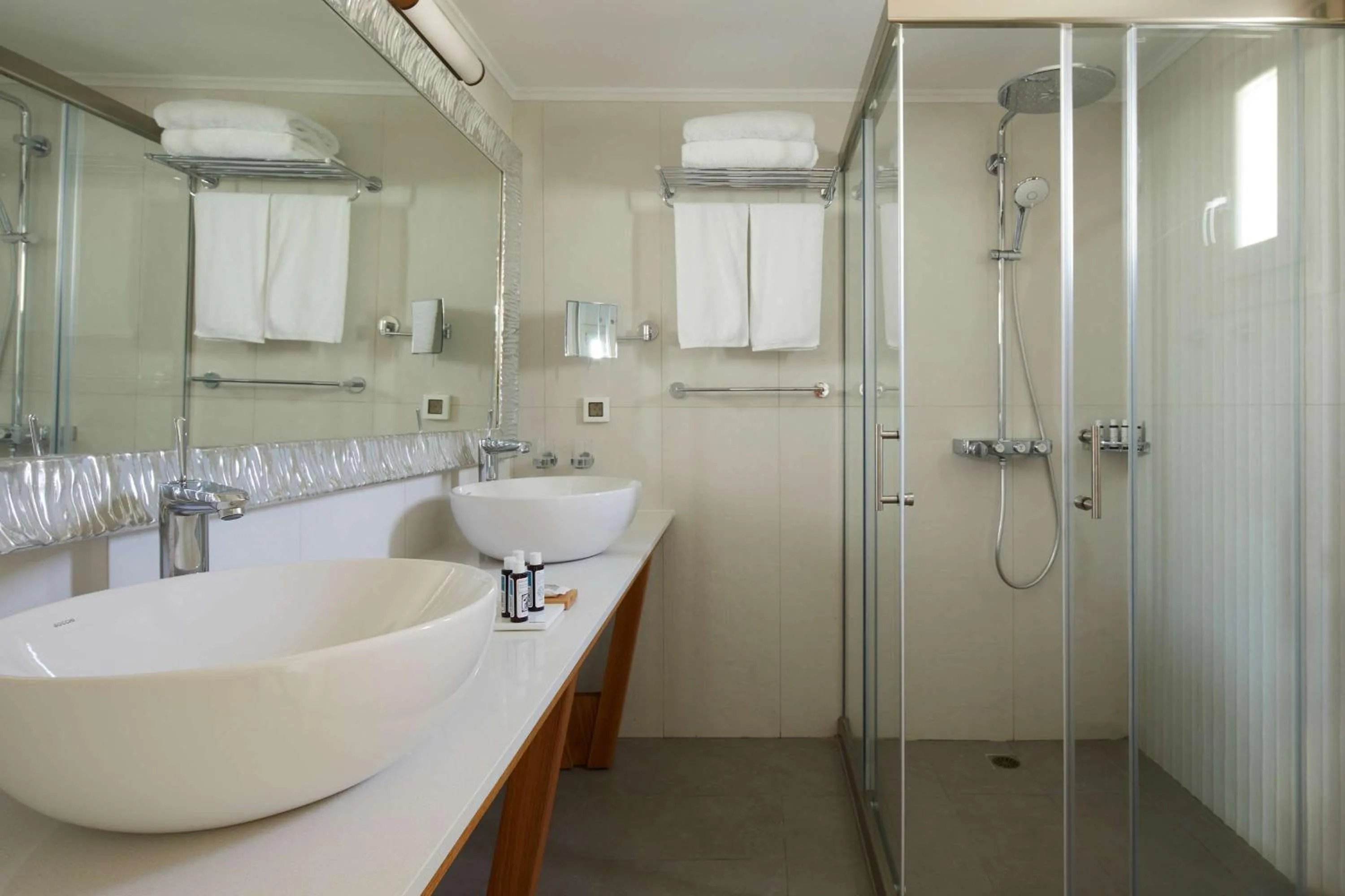 Bathroom in Sea Breeze Santorini Beach Resort, Curio By Hilton