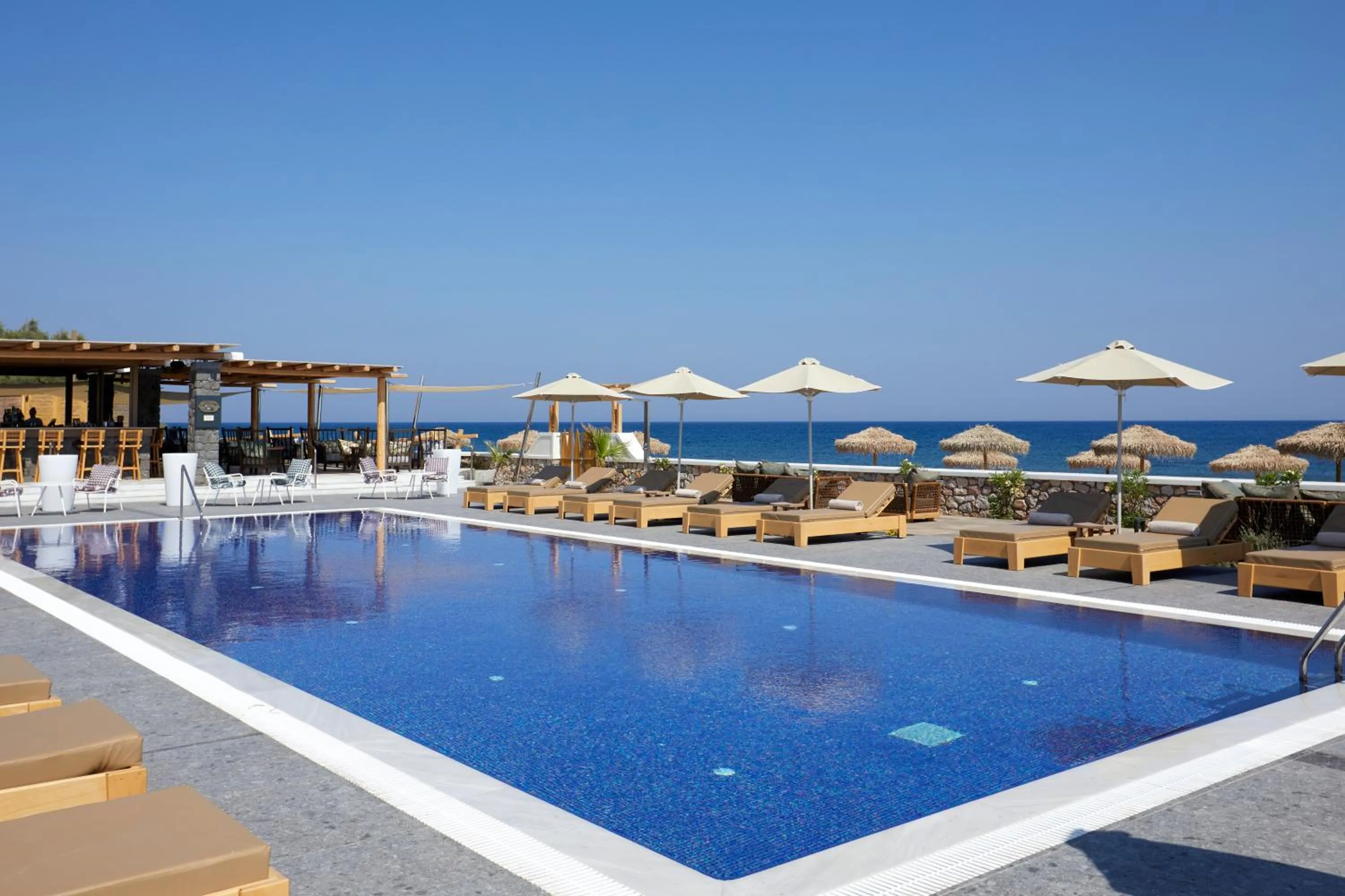 Lounge or bar in Sea Breeze Santorini Beach Resort, Curio By Hilton