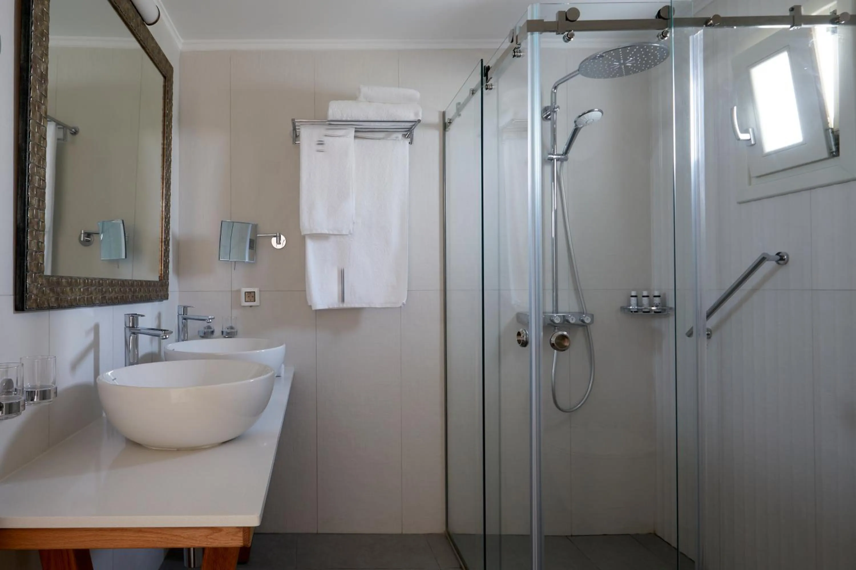 Shower in Sea Breeze Santorini Beach Resort, Curio By Hilton