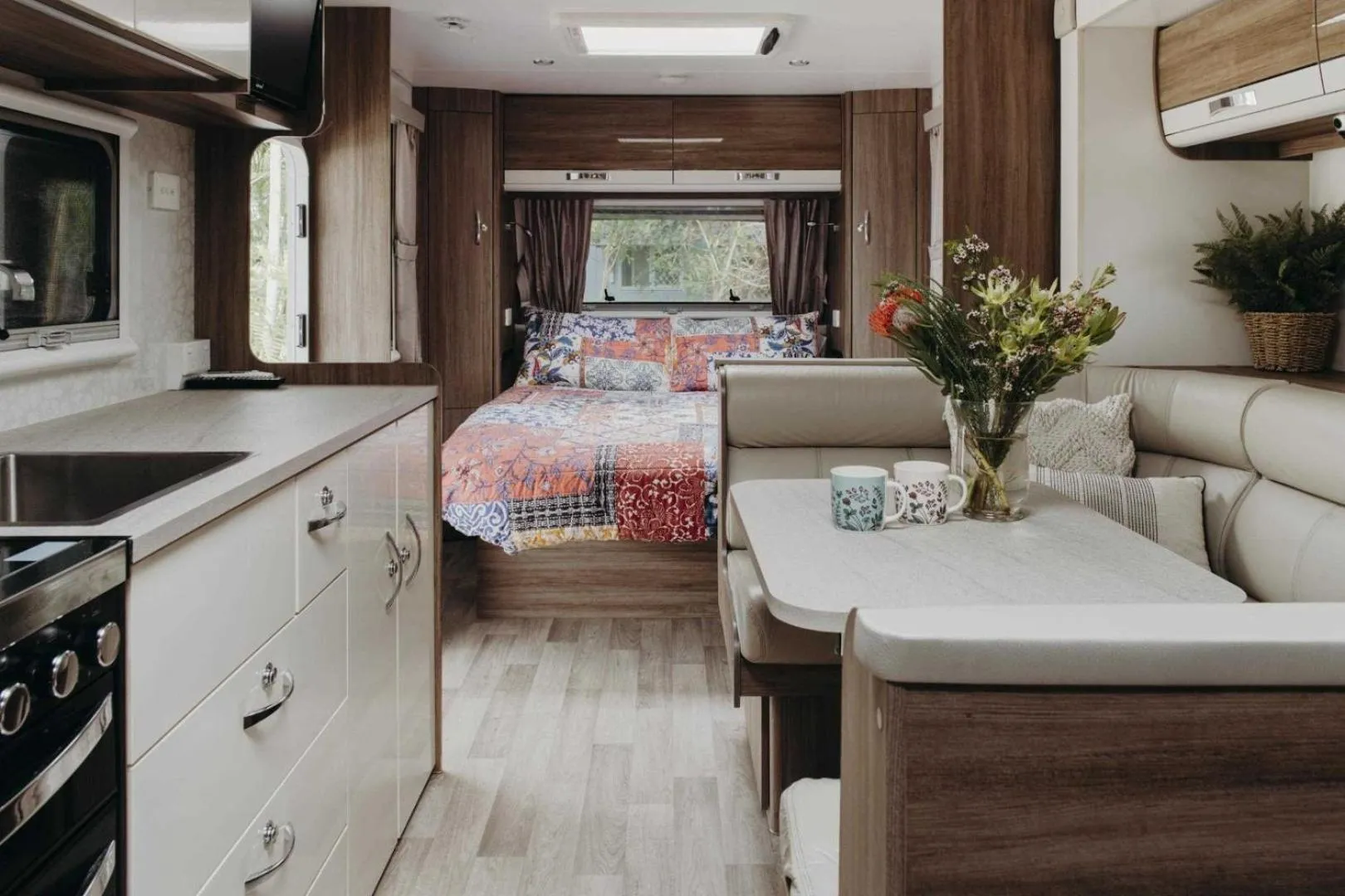 Kitchen or kitchenette, Bed in Reflections Byron Bay - Holiday Park