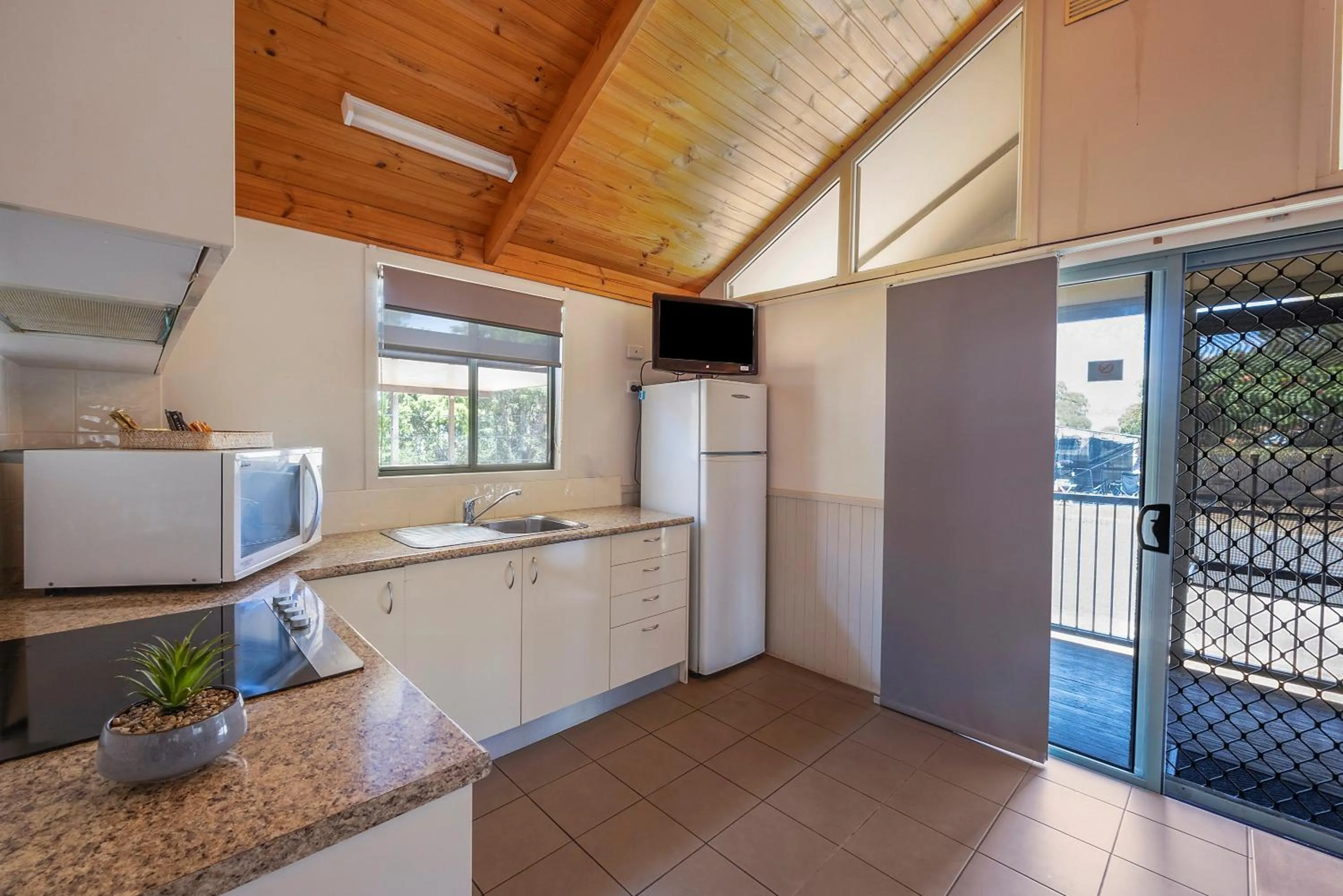 Kitchen or kitchenette in Reflections Tuncurry - Holiday Park