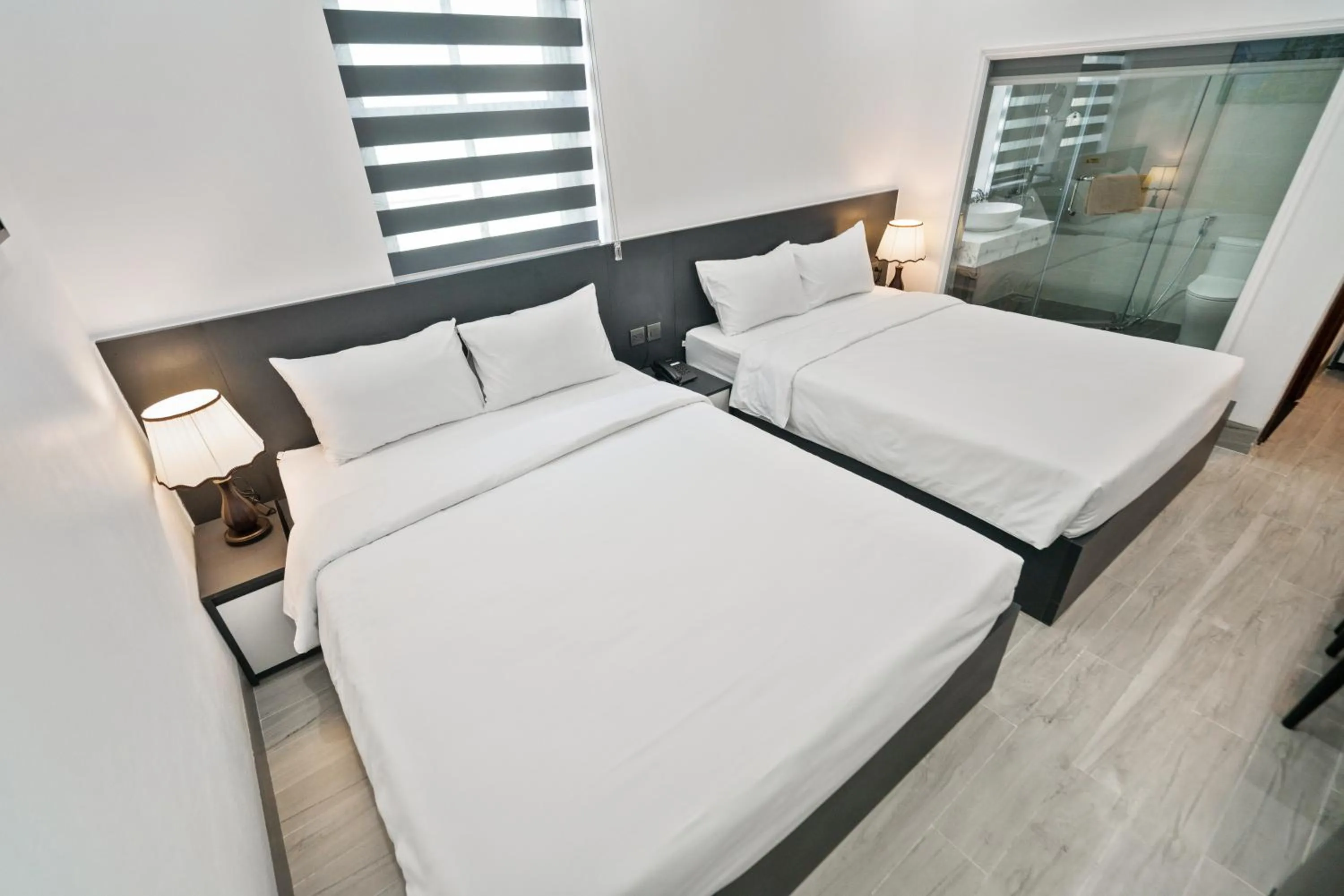 Bed in The Enchanted Ha Long Hotel