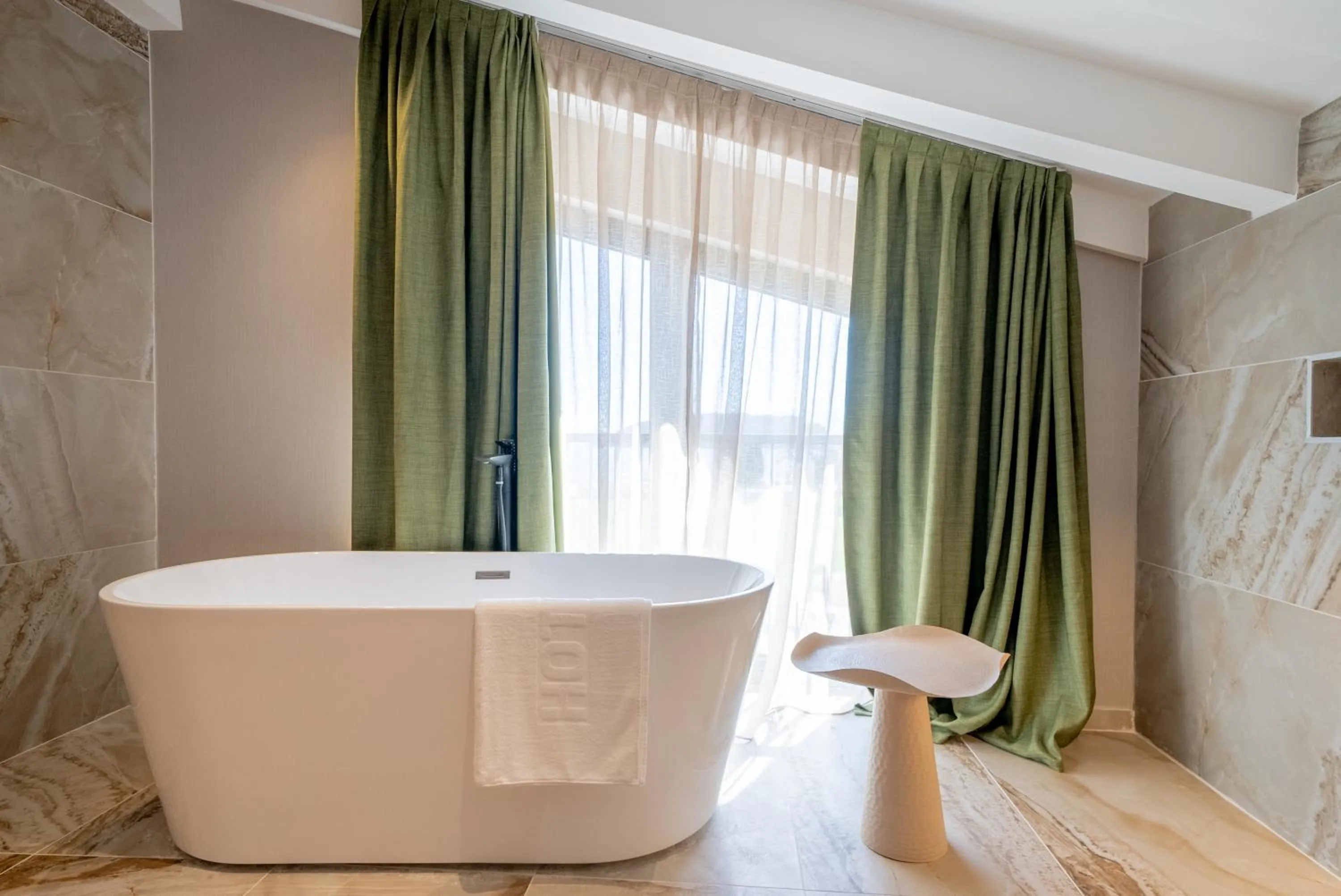 Bathroom in Hotel Millennium by Aycon