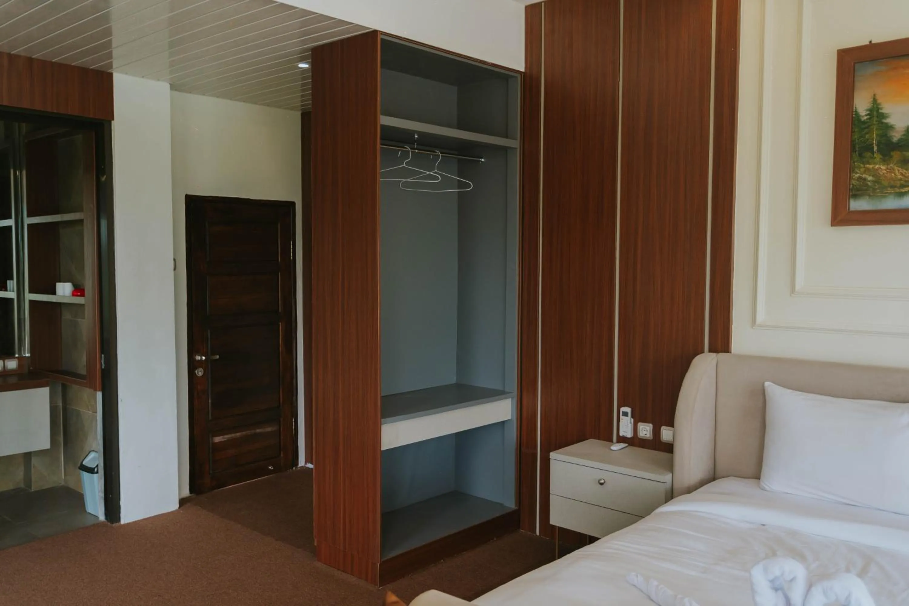 wardrobe, Bed in Nirvana Hotel Resort Tetebatu