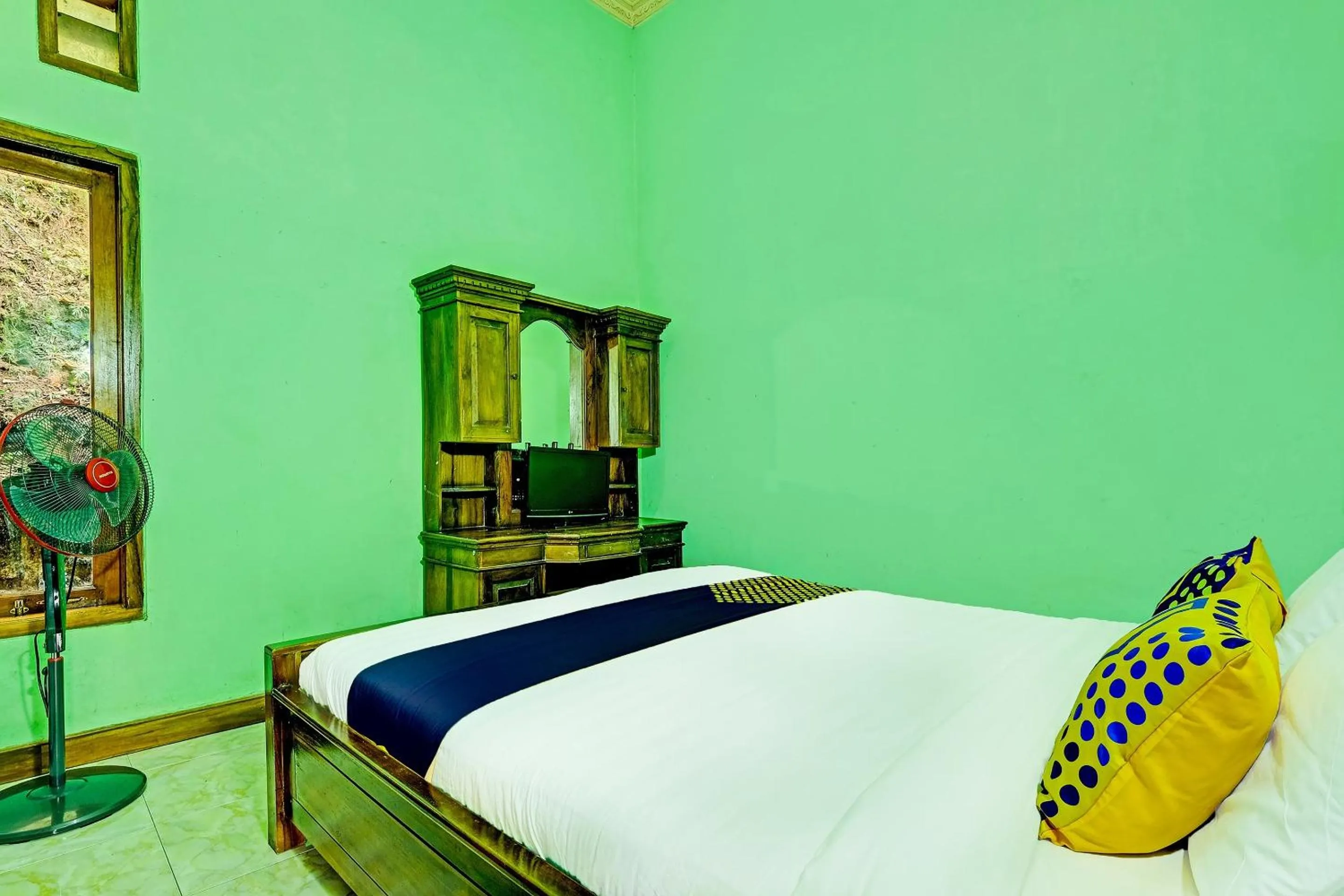 Bedroom in OYO Homes 91095 Desa Wisata Conto