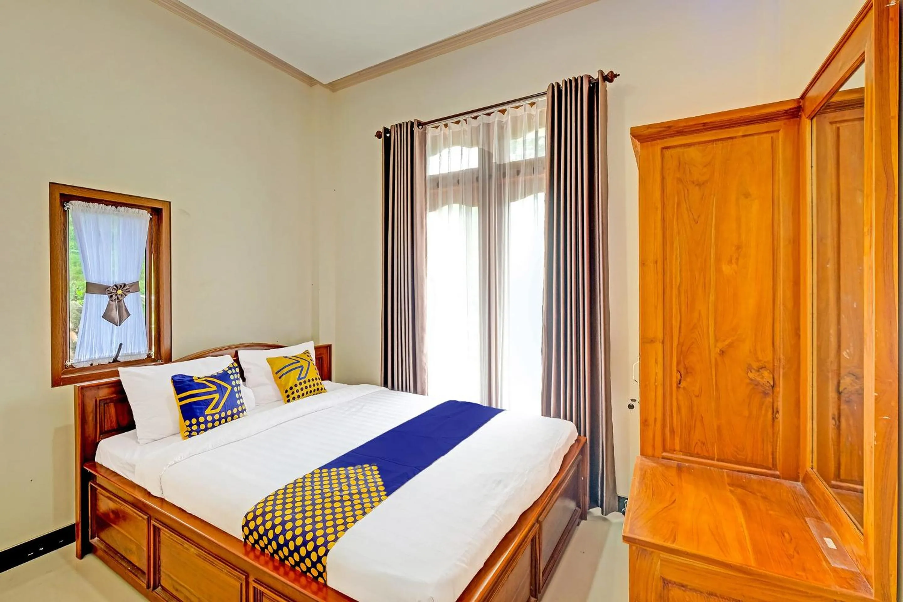 Bedroom in OYO Homes 91095 Desa Wisata Conto