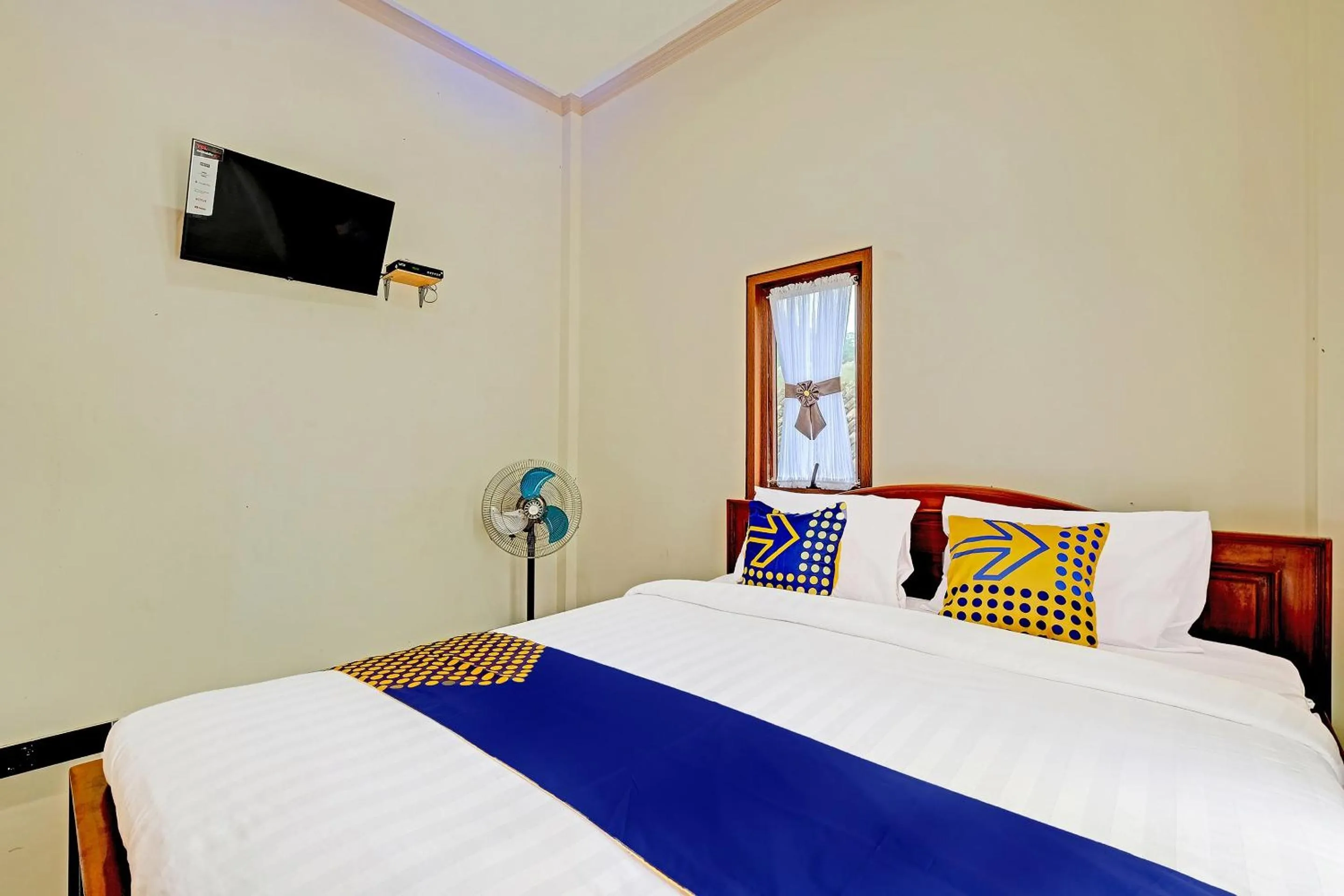 Bedroom in OYO Homes 91095 Desa Wisata Conto