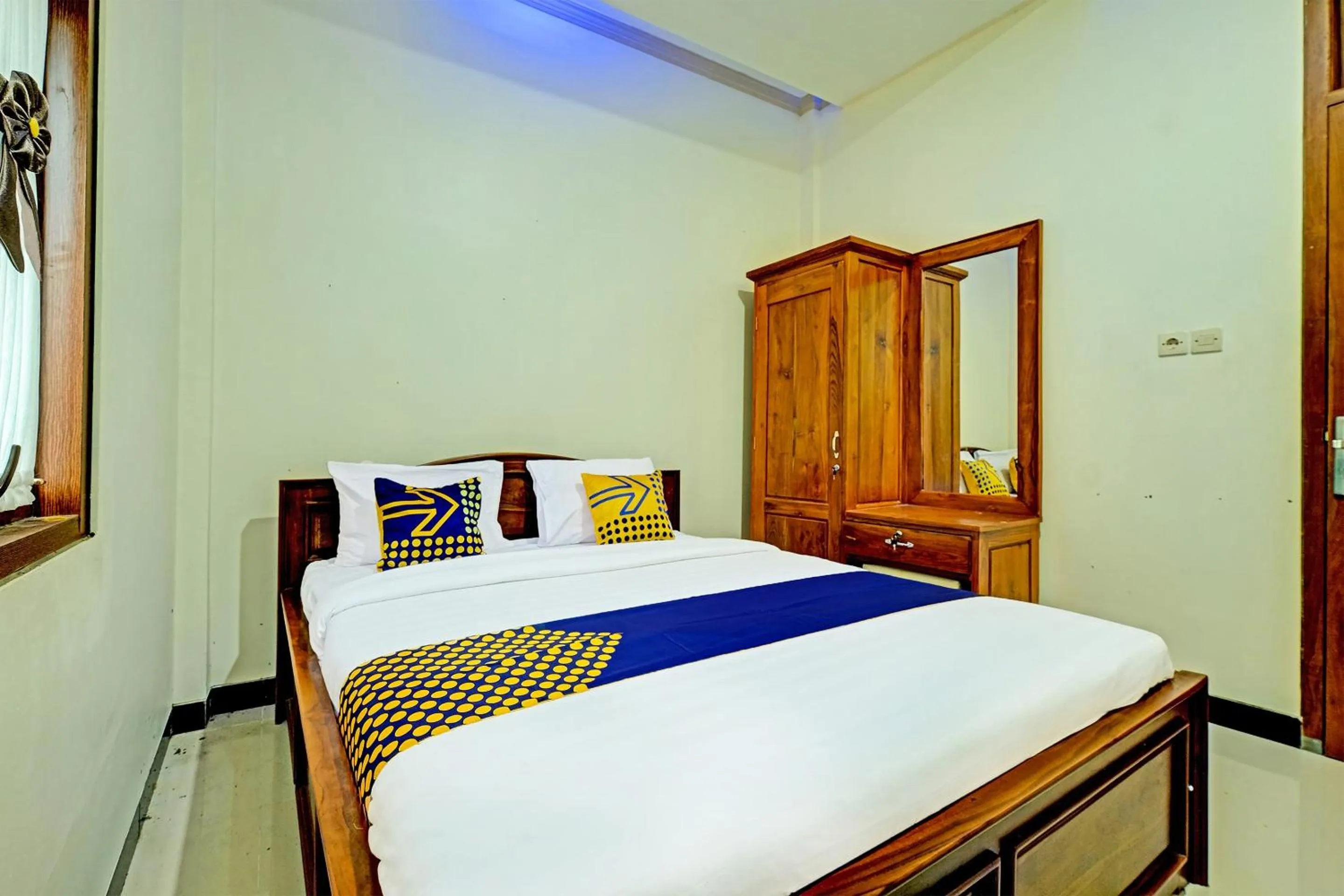 Bedroom in OYO Homes 91095 Desa Wisata Conto