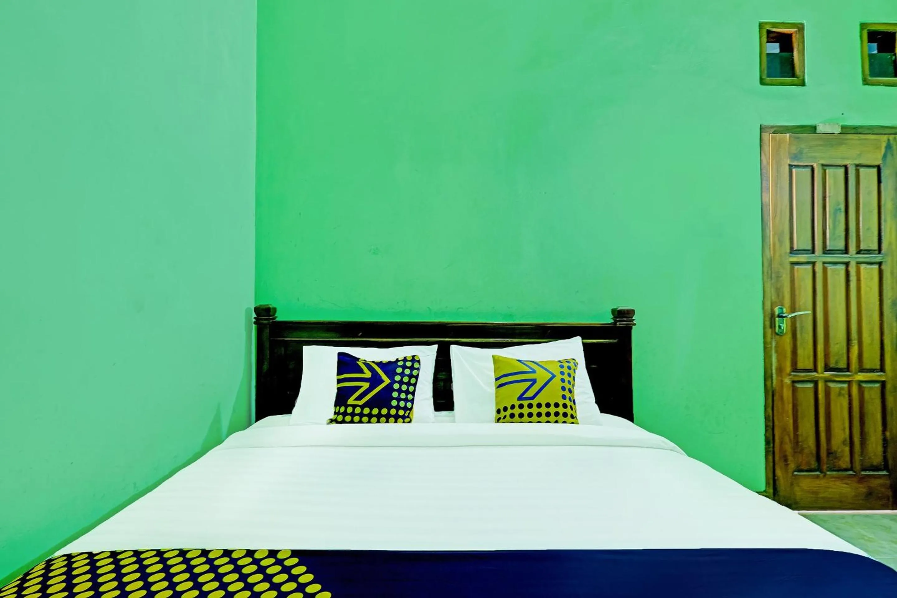 Bedroom in OYO Homes 91095 Desa Wisata Conto