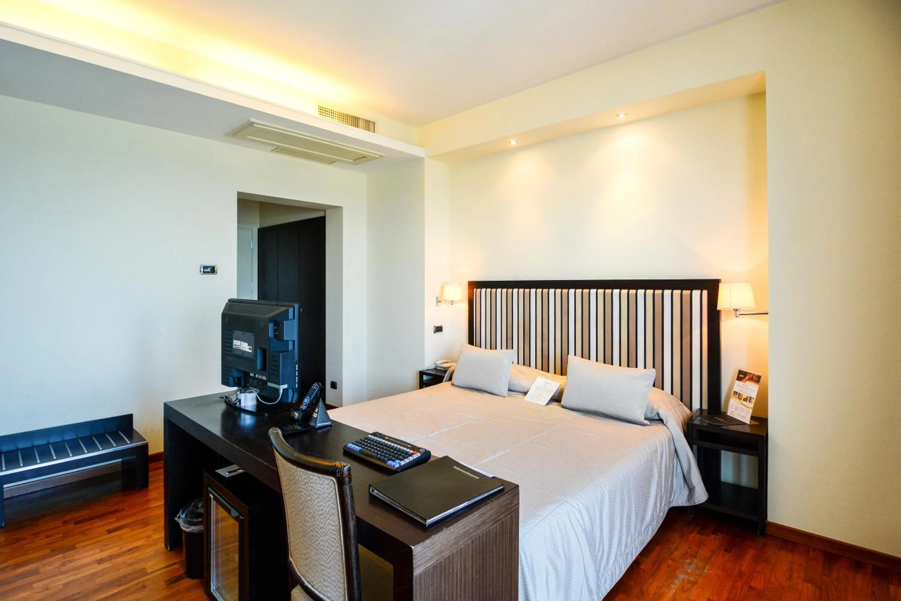 Bedroom in Terrazza Marconi Hotel&Spamarine