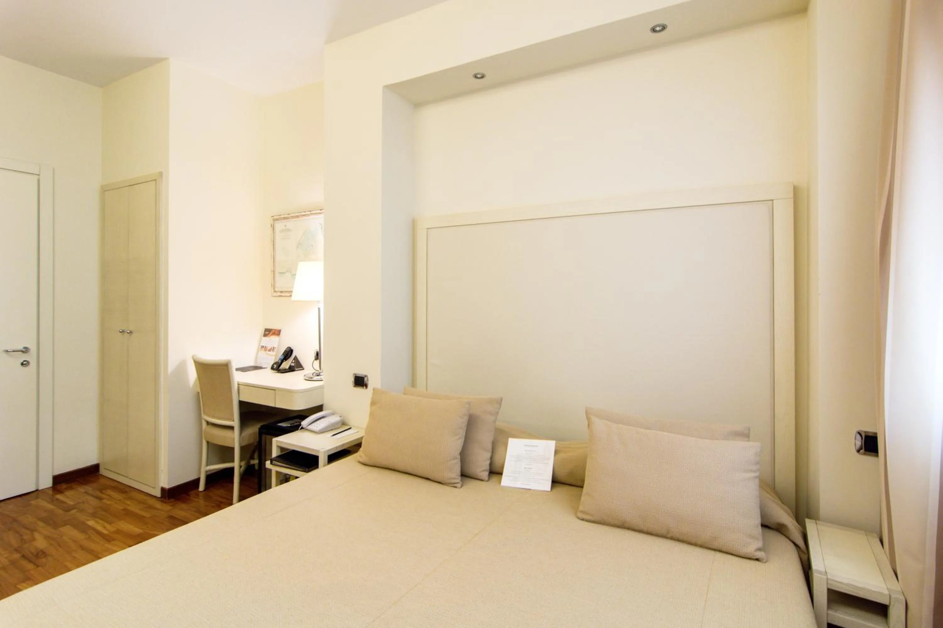 Bedroom in Terrazza Marconi Hotel&Spamarine