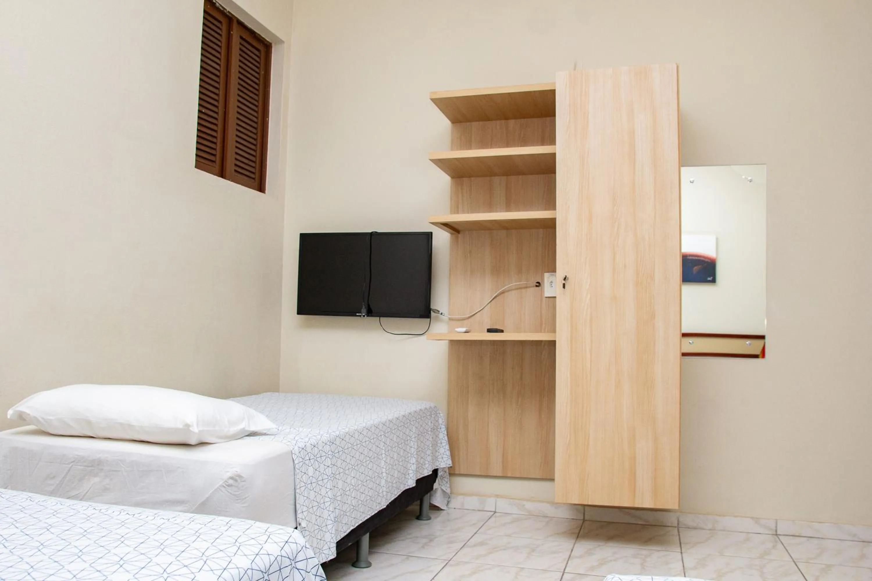 Bed in Pousada Casarão 2030