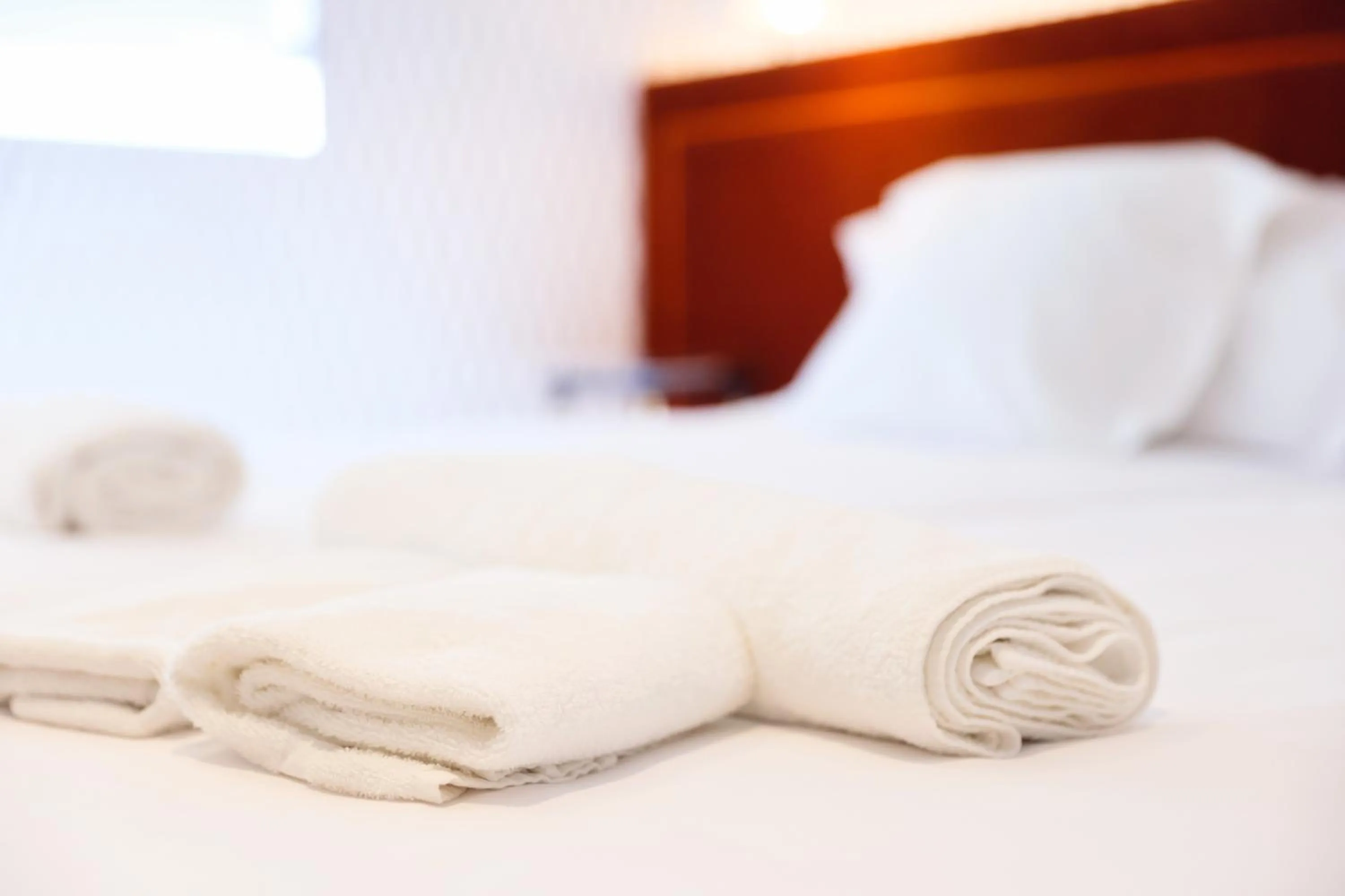 towels, Bed in THE APARTMENT by assethoteles