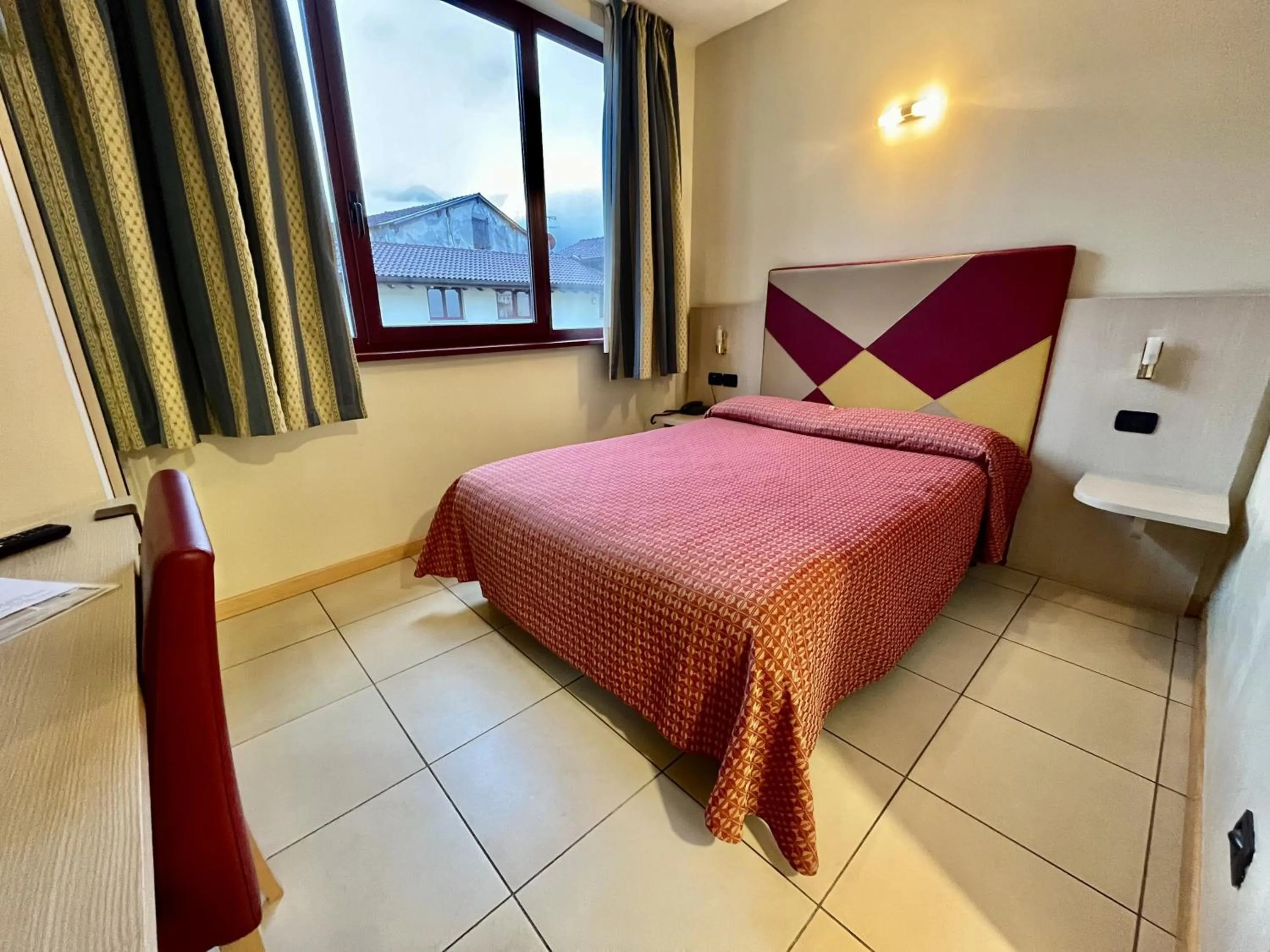 Bed in Hotel Lovere Resort & Spa