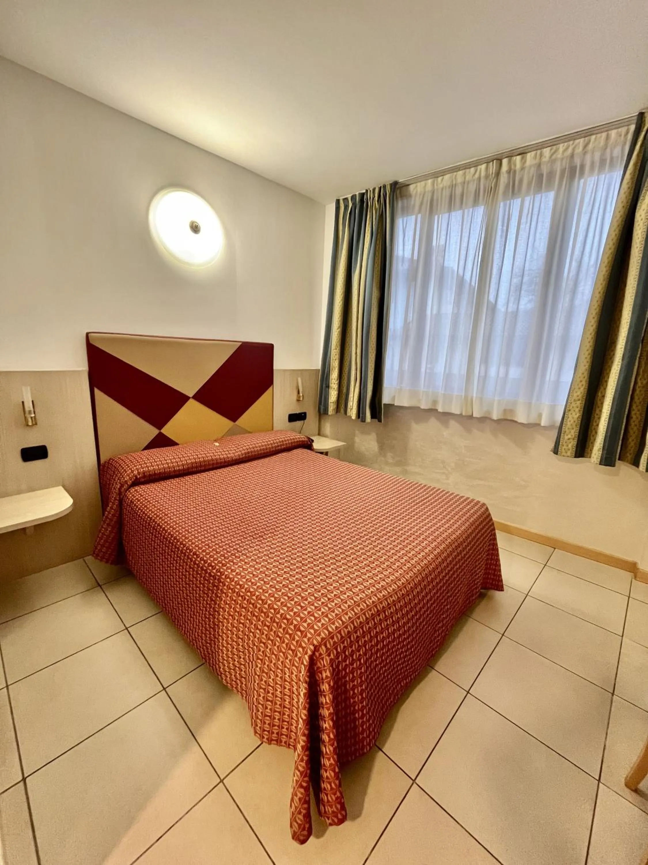 Bed in Hotel Lovere Resort & Spa