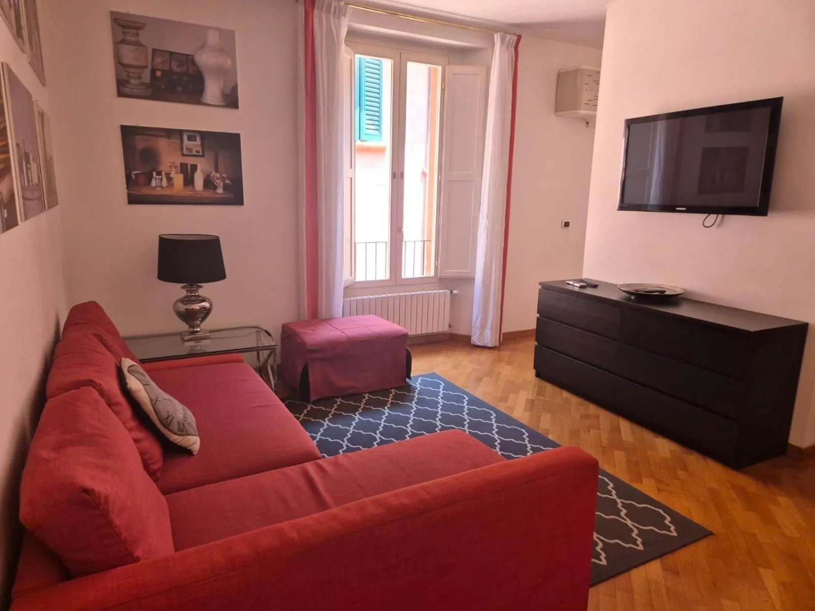 Communal lounge/ TV room in Phi Hotel Bologna Apartments