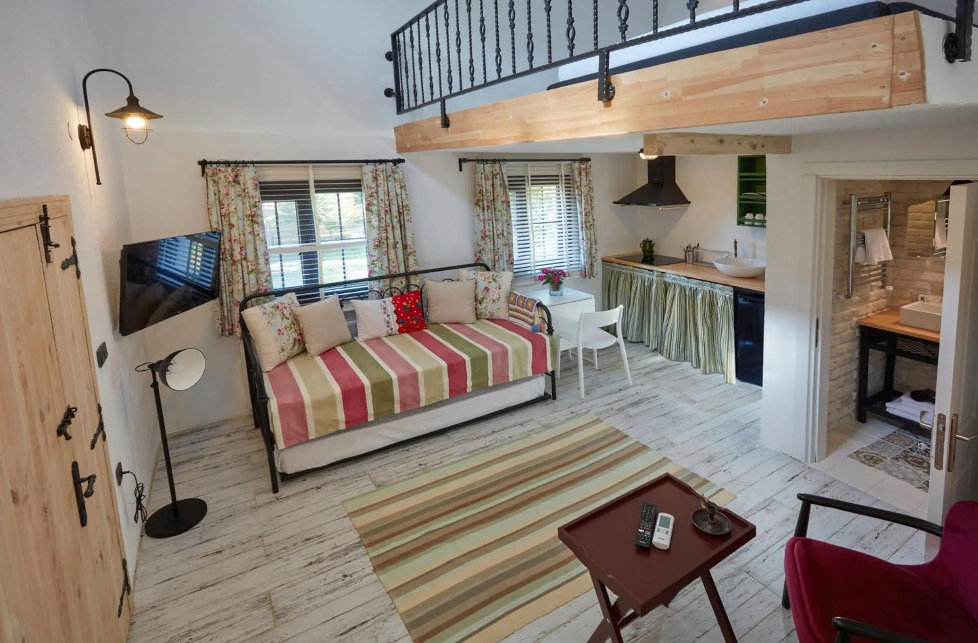 Communal lounge/ TV room, Bed in Dachas Cove Hotel