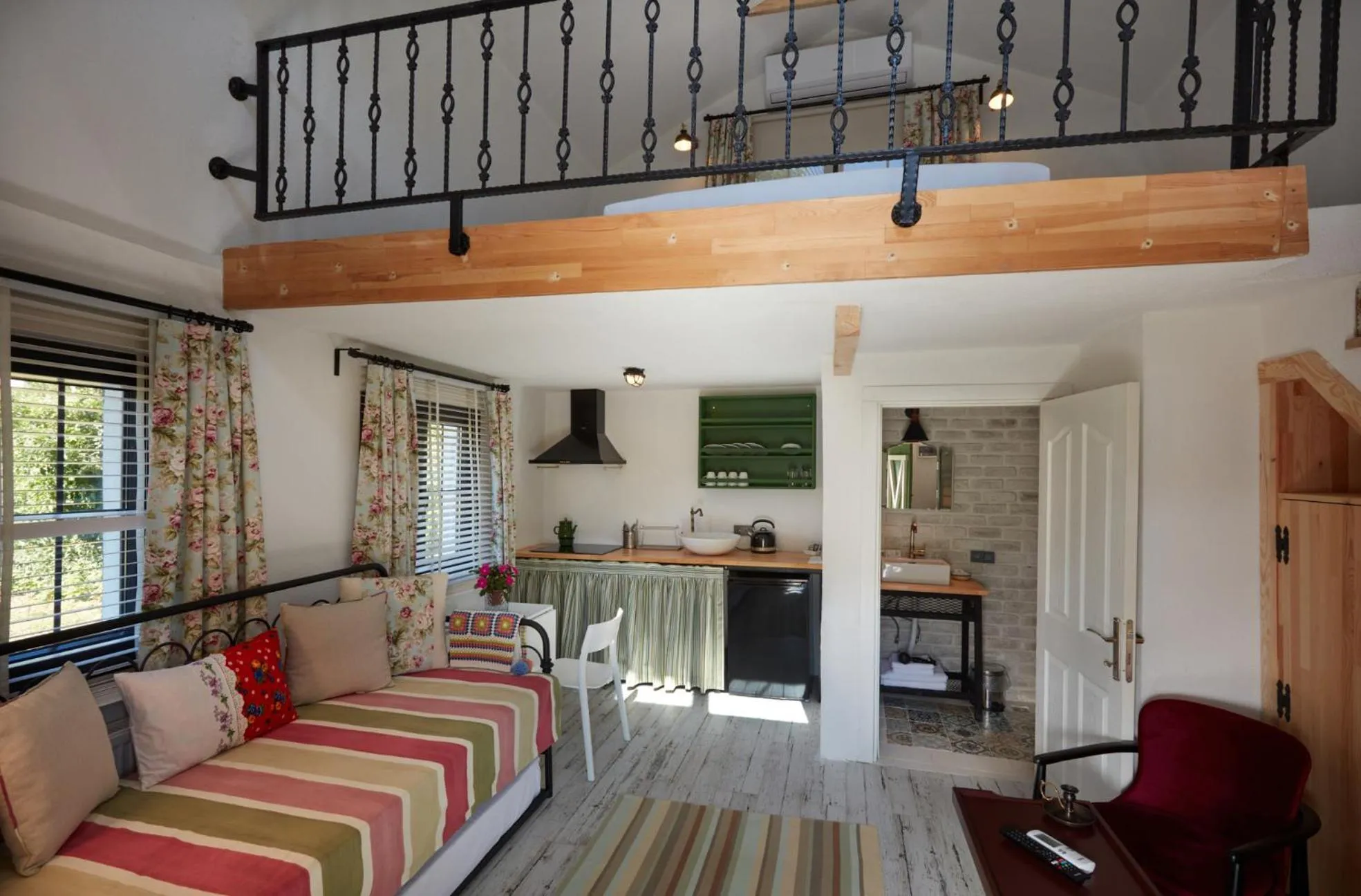 Communal lounge/ TV room, Bed in Dachas Cove Hotel