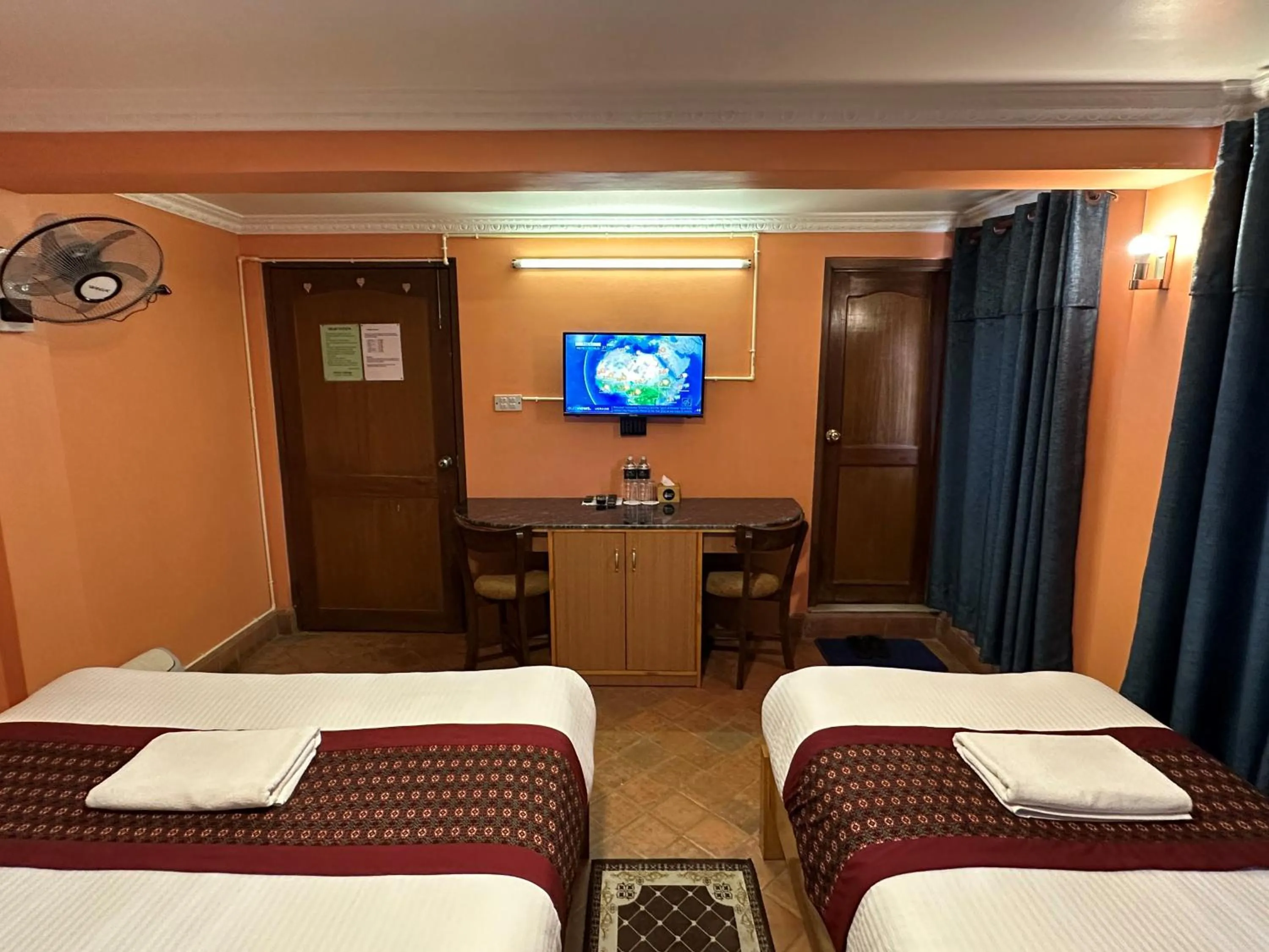 Bed in Hotel Empire & Rooftop Restaurant