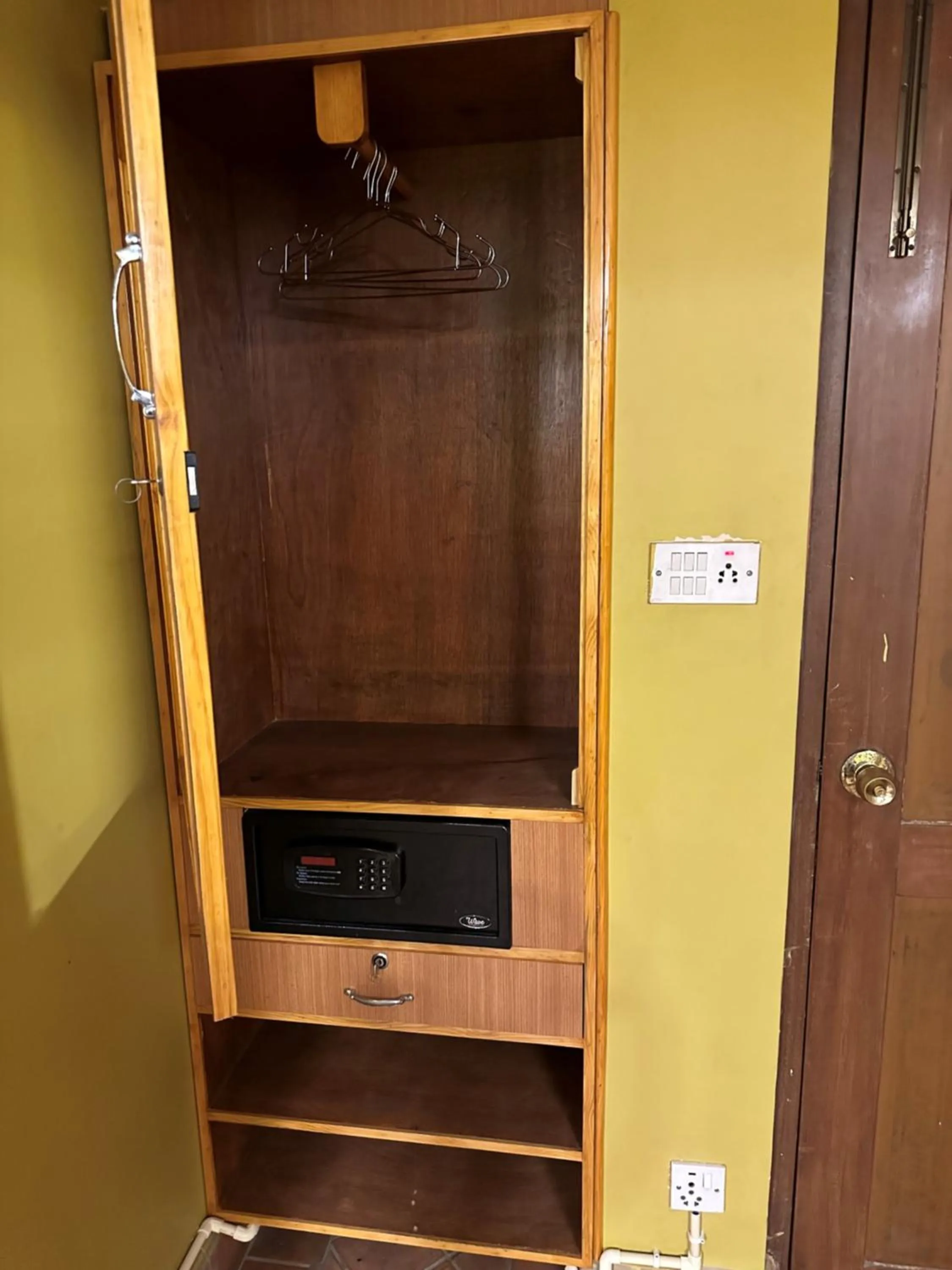 wardrobe in Hotel Empire & Rooftop Restaurant