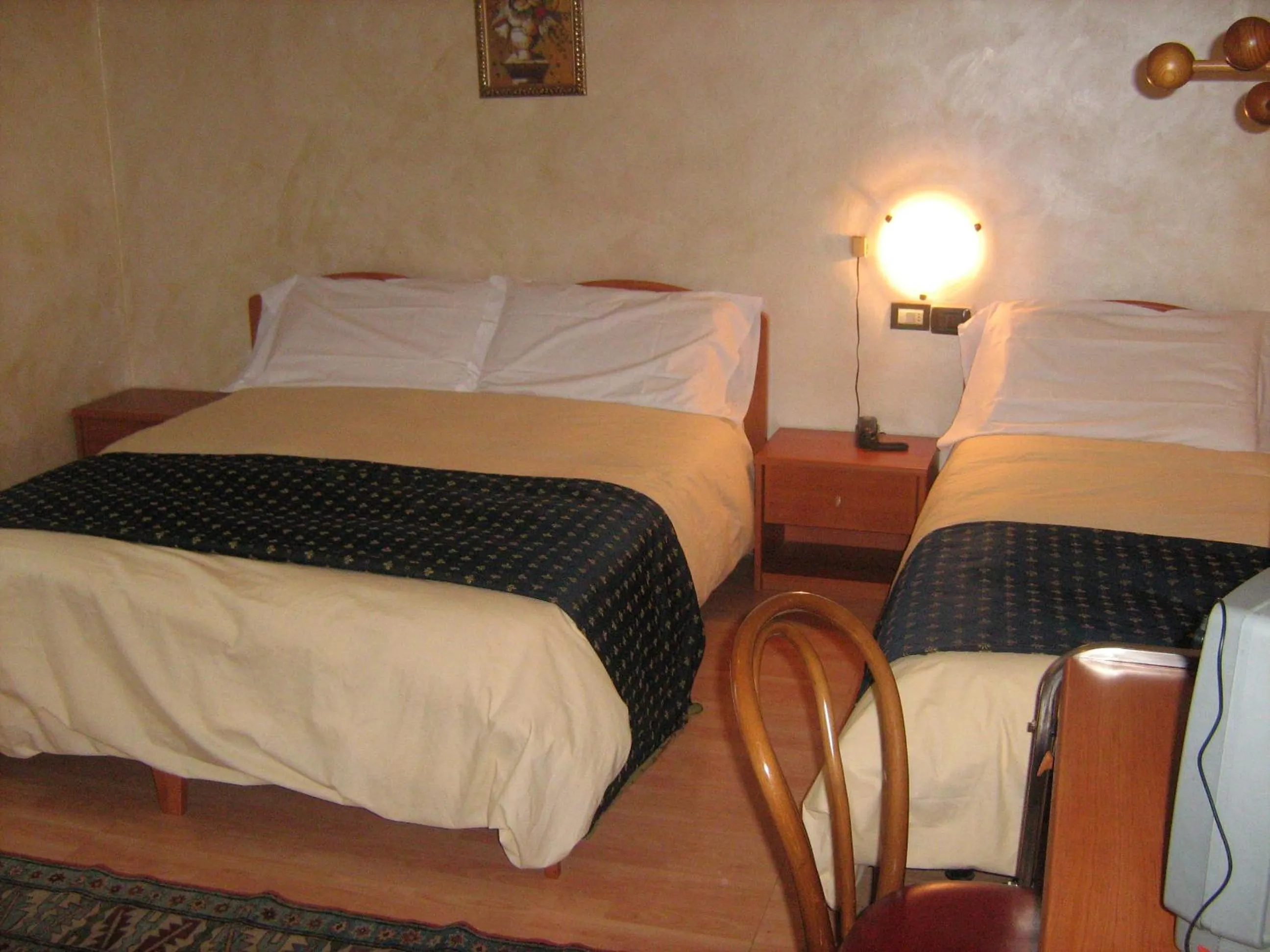 Bed in Hotel San Marino