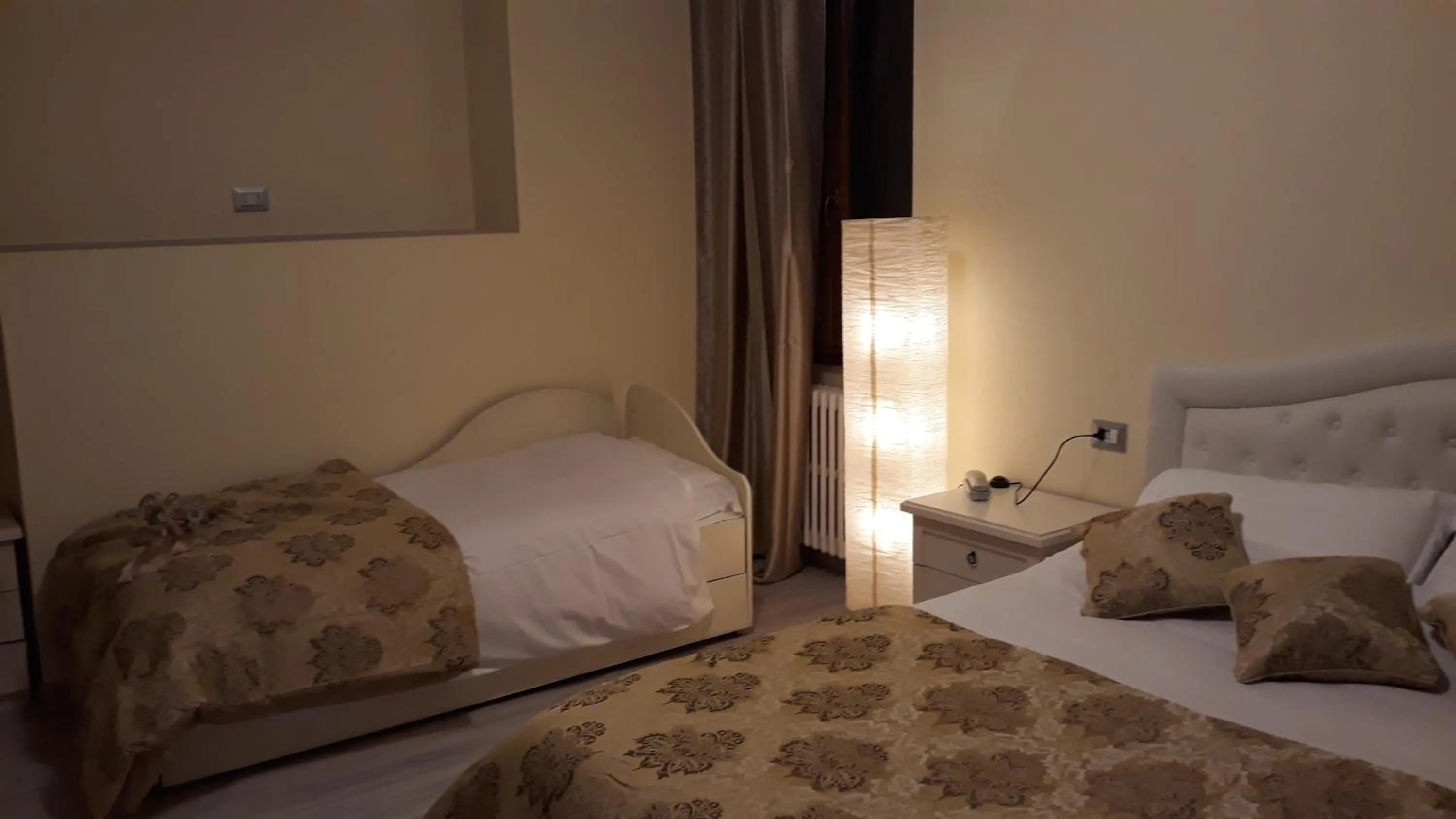 Bed in Hotel San Marino