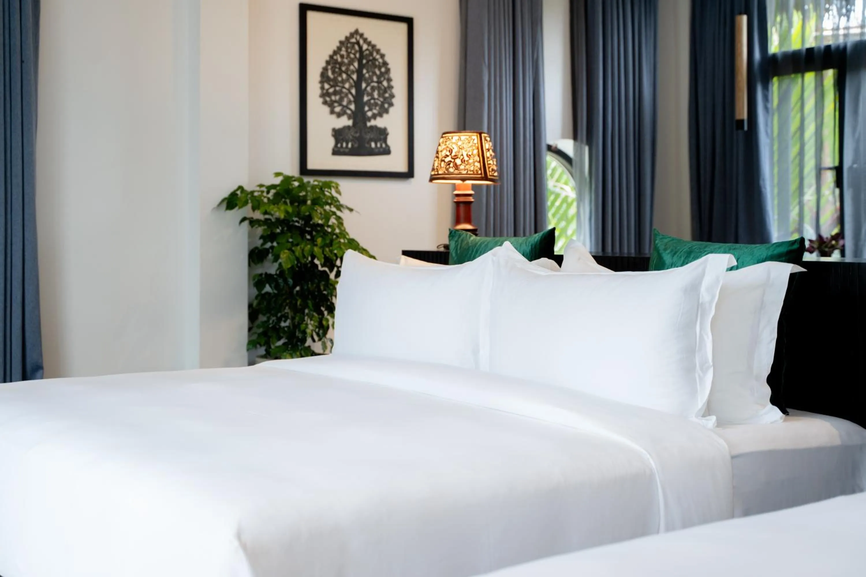 Bed in RiverTree Villa & Resort