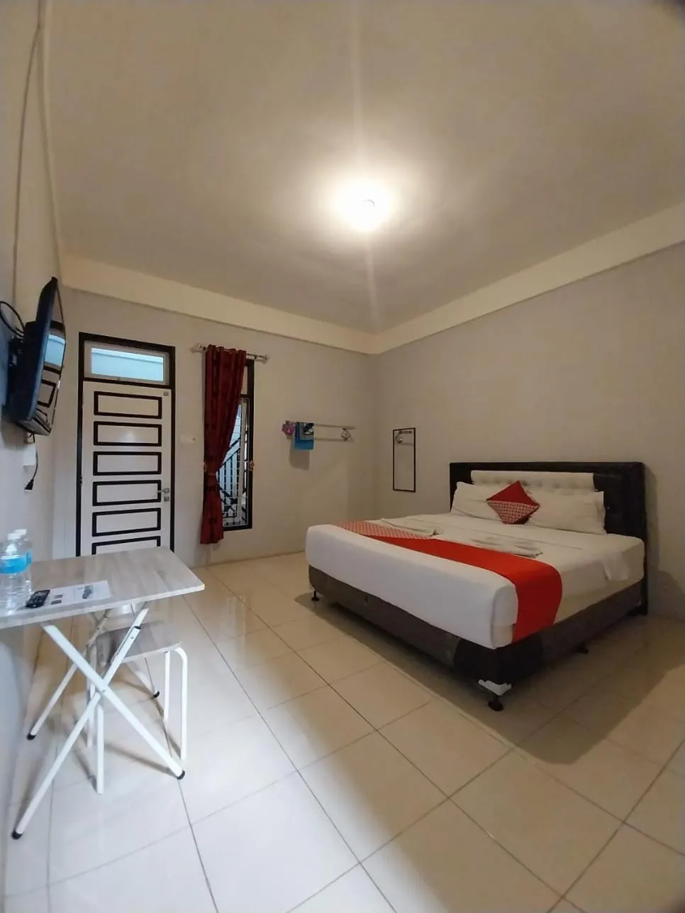 Bed in Dnaiko Syariah Hotel