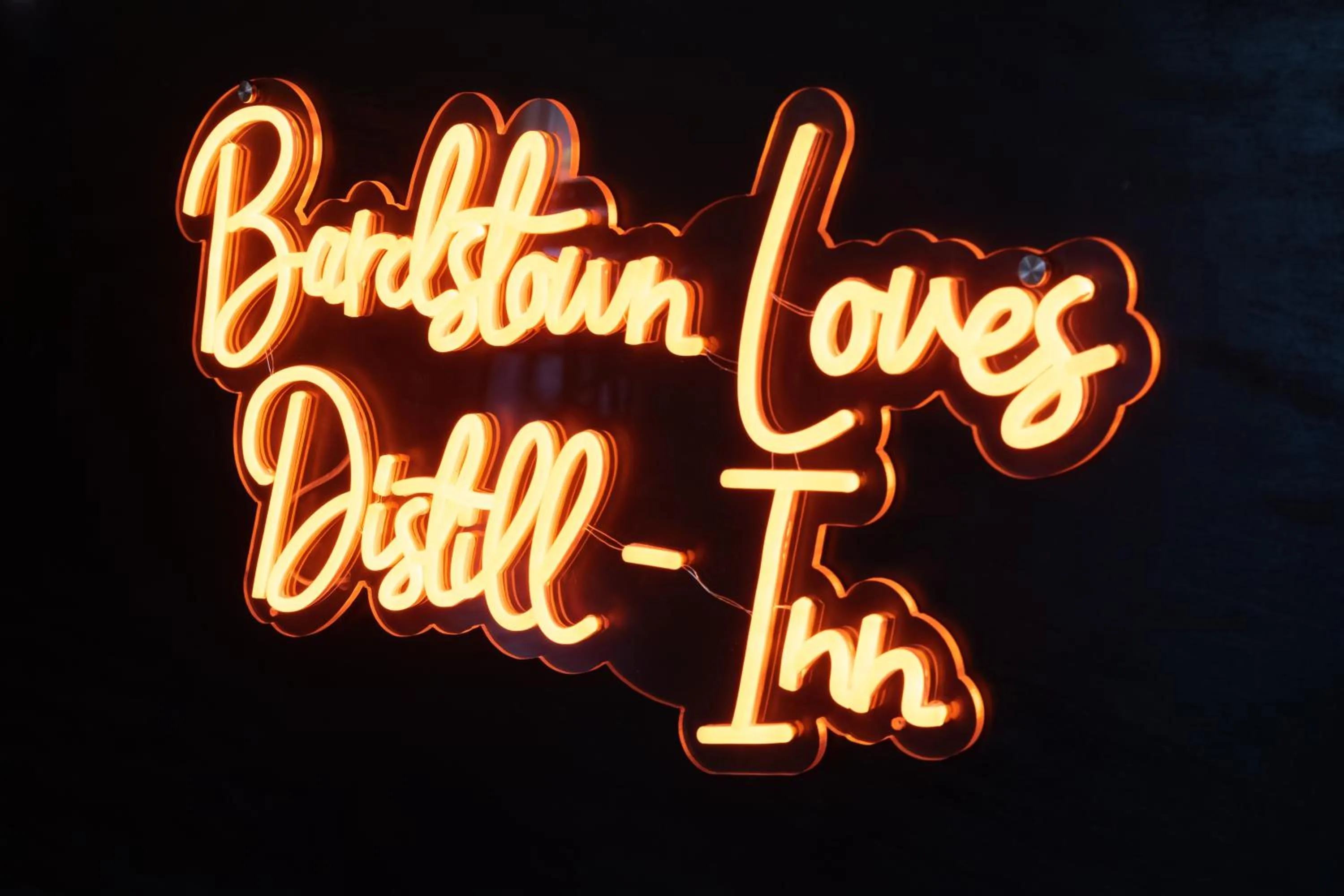 Property logo or sign in Distill-Inn