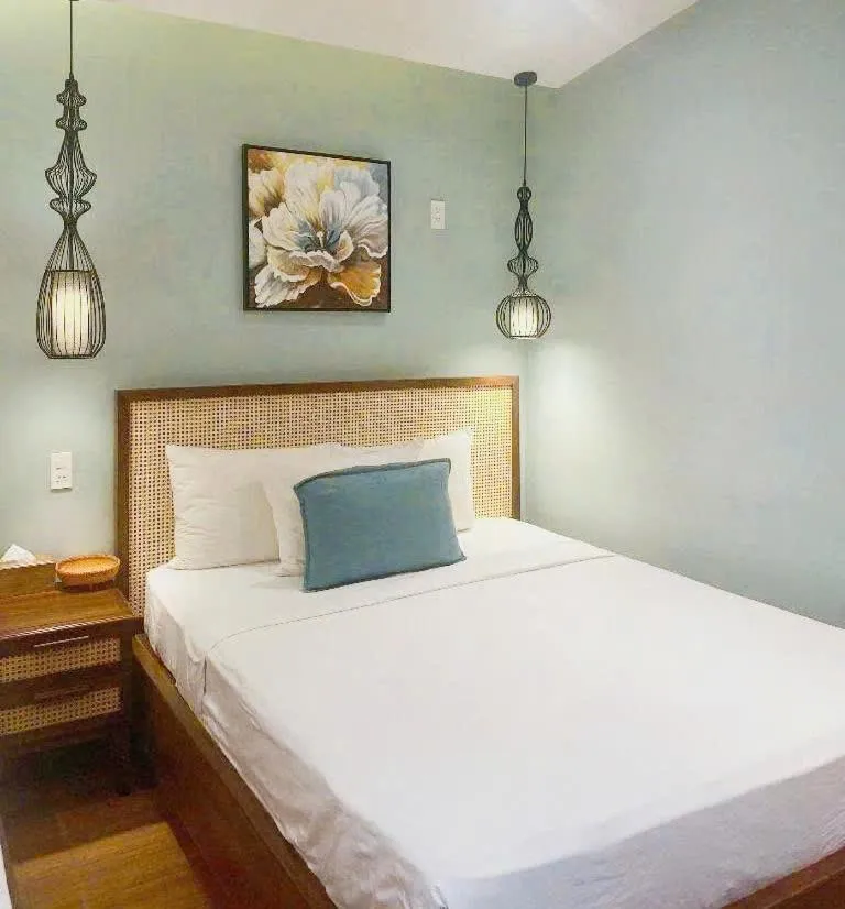 Bed in FLOWER BEACHSTAY & COFFEE