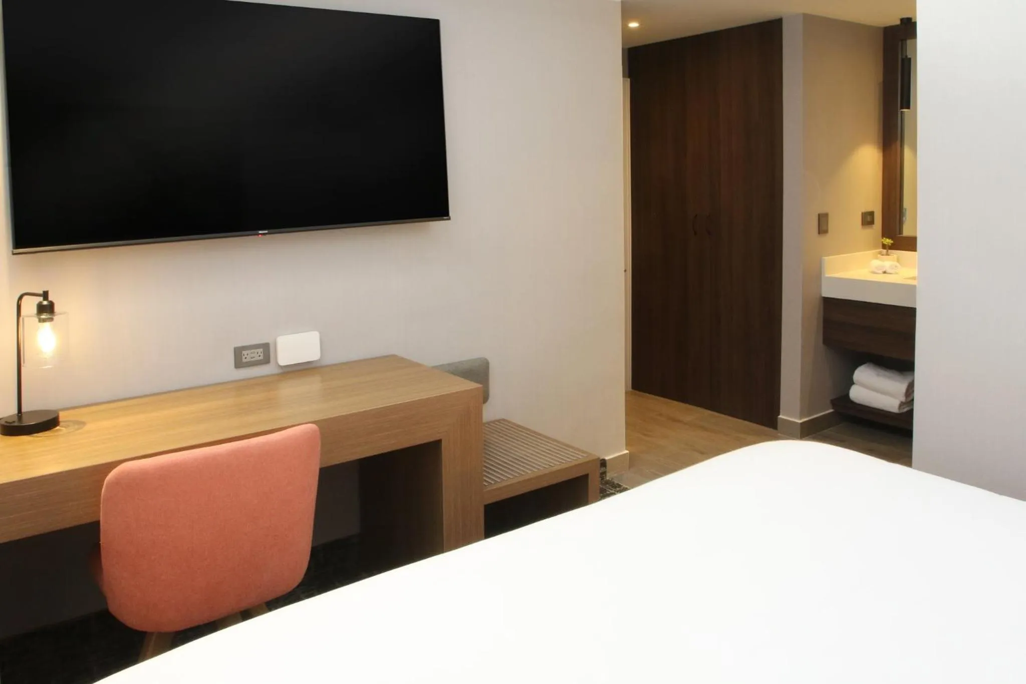 Photo of the whole room, Bed in voco Saltillo Suites by IHG