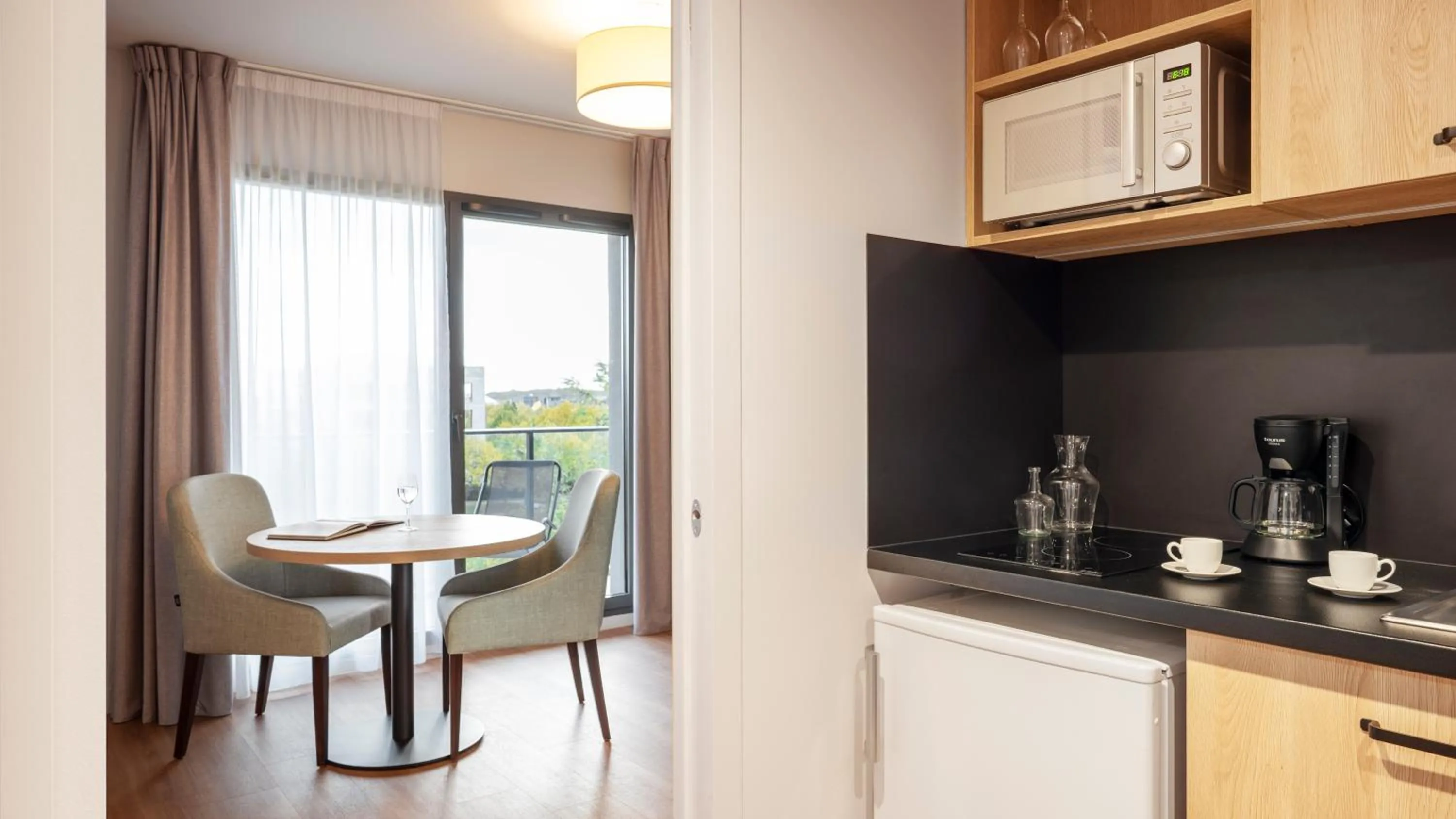 Kitchen or kitchenette in Residhome Sénart