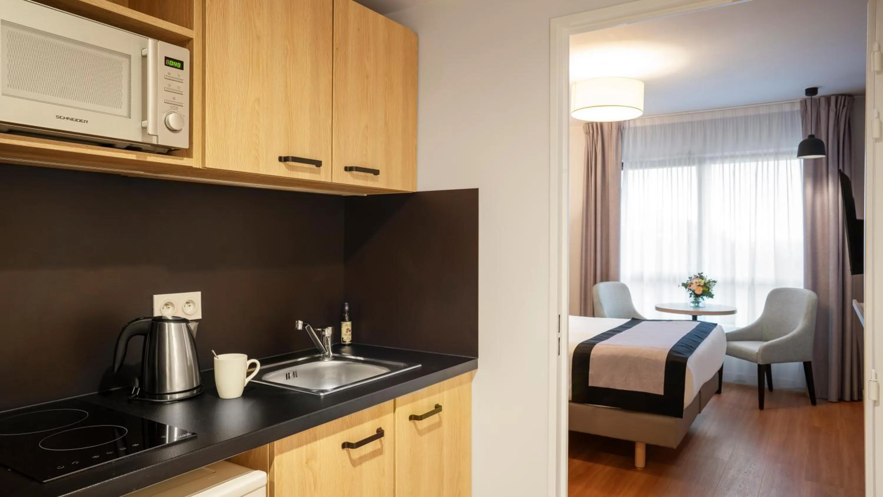 Kitchen or kitchenette, Bed in Residhome Sénart