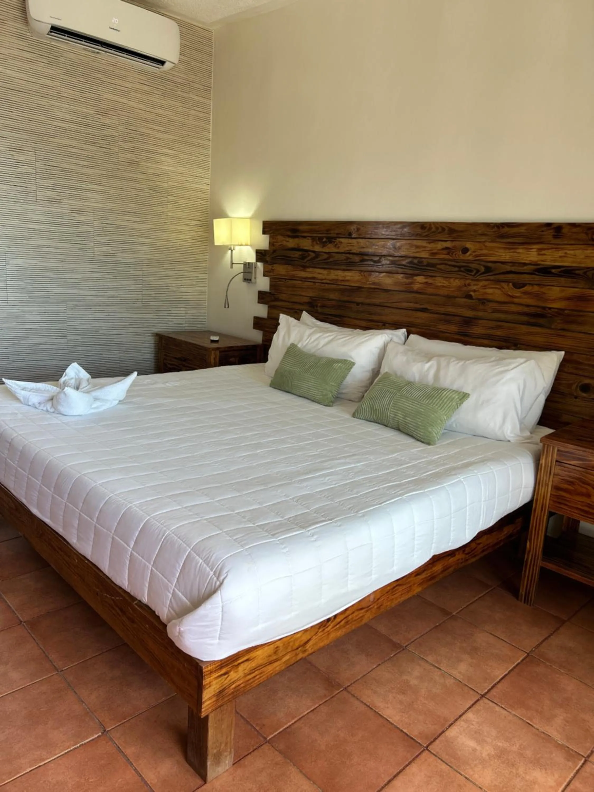 Bed in Brisas Del Mar Beach + Dive Resort