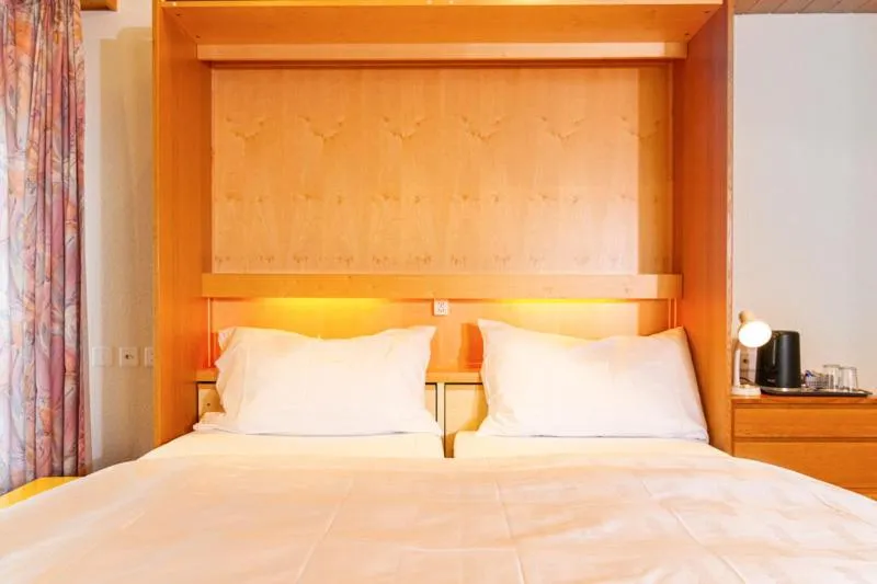 Bed in Hotel Swiss Views