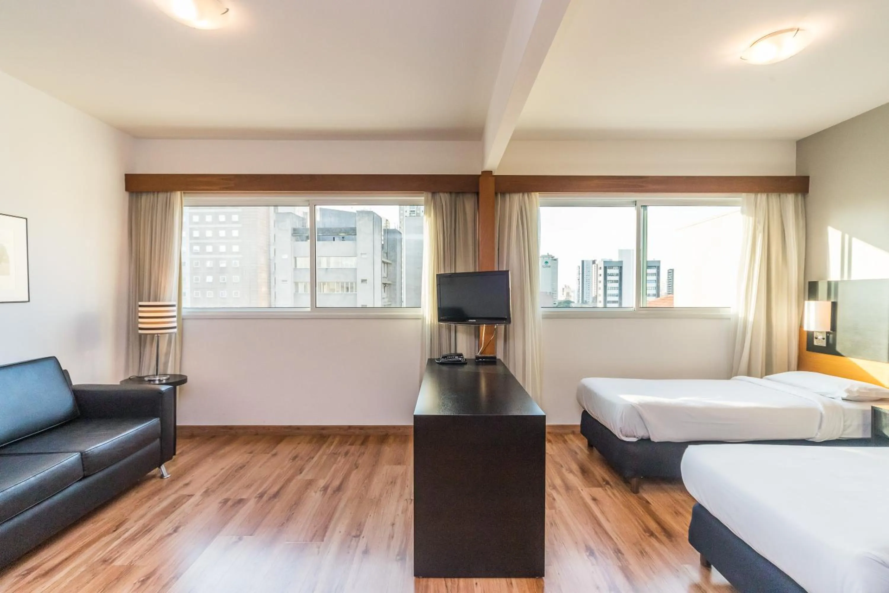 Bed in Paraíso Suítes by Charlie