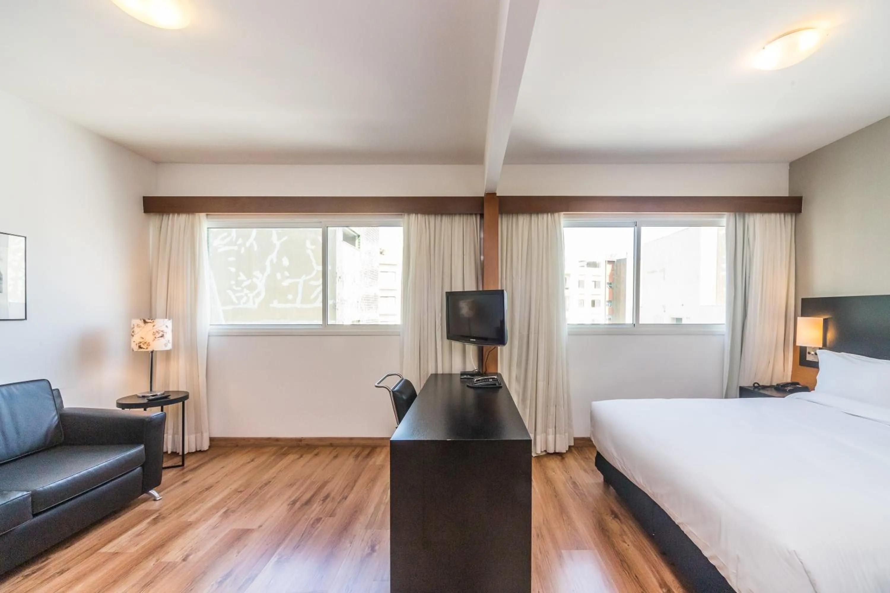 Bed in Paraíso Suítes by Charlie